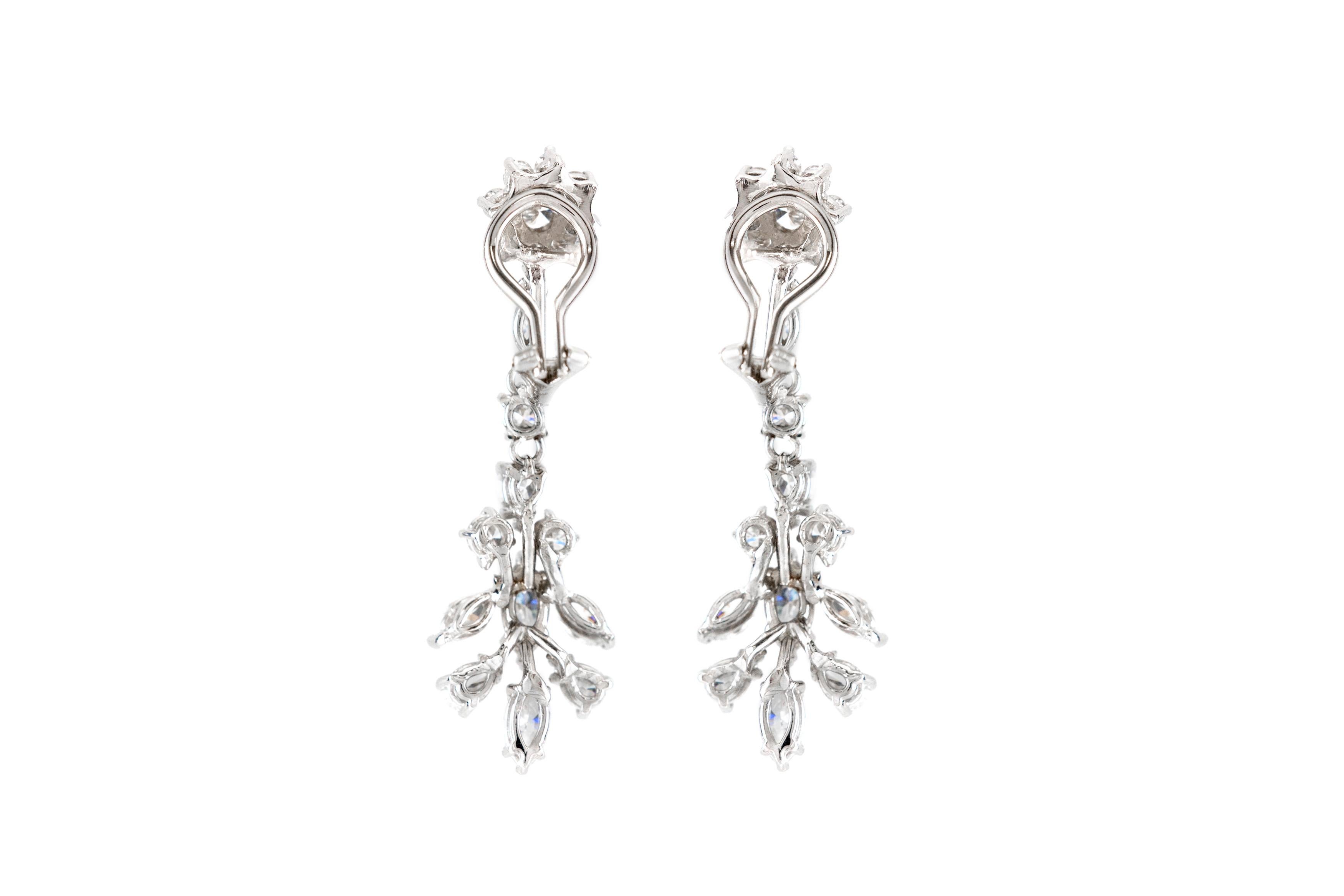 The earrings is finely crafted in 14k and 18k white gold with different dimamonds cut weighing approximately total of 5.00 carat,
Color G H
Clarity VS