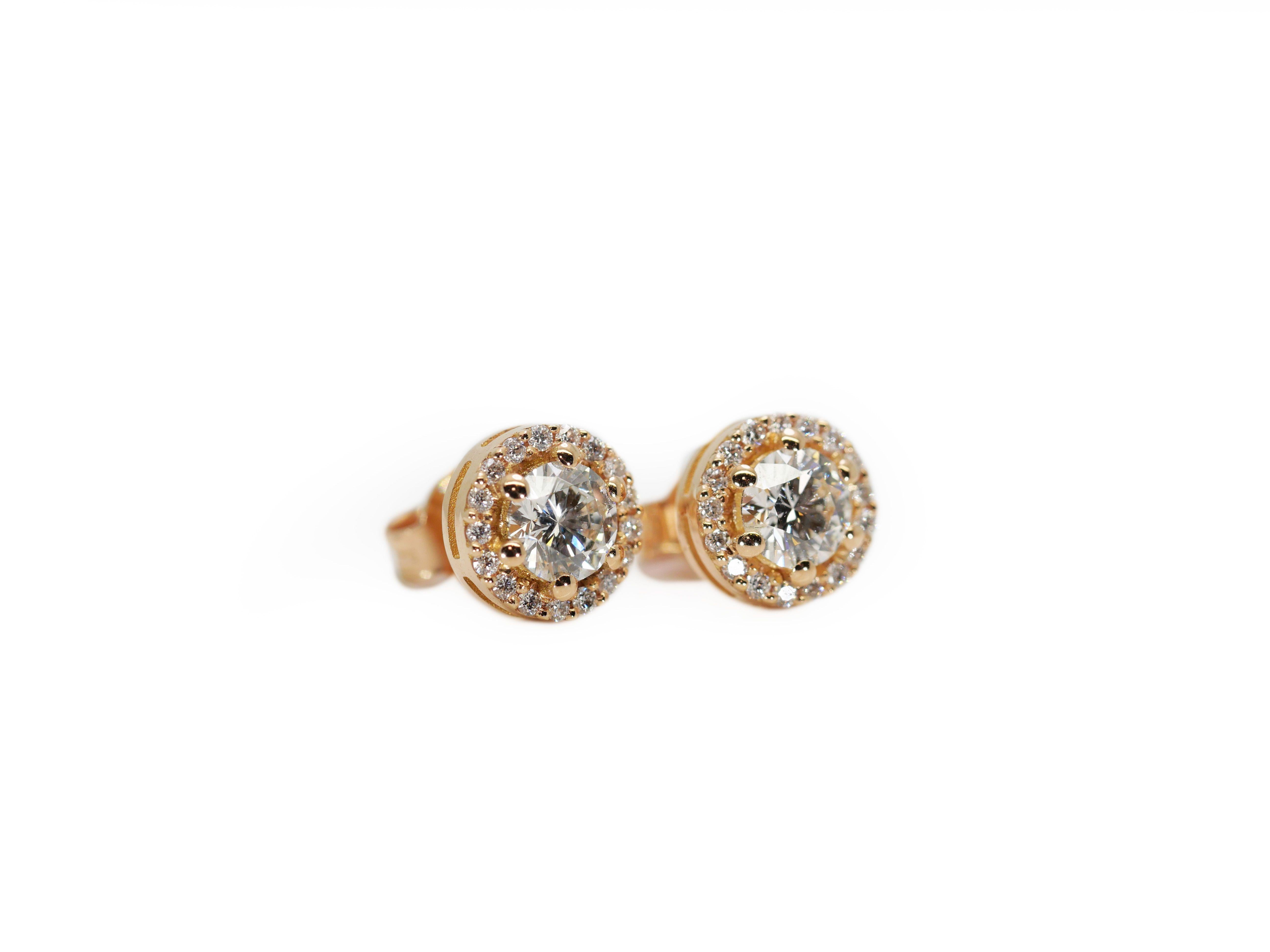 Beautiful Pair of Halo Diamond Earrings made from 18K Rose gold with 0.97 total carat of round brilliant diamonds.

-2 diamond main stone of 0.40 ct. each, total: 0.80 ct. 
cut: round brilliant
color: F
clarity: SI1

-34 diamond side stones of