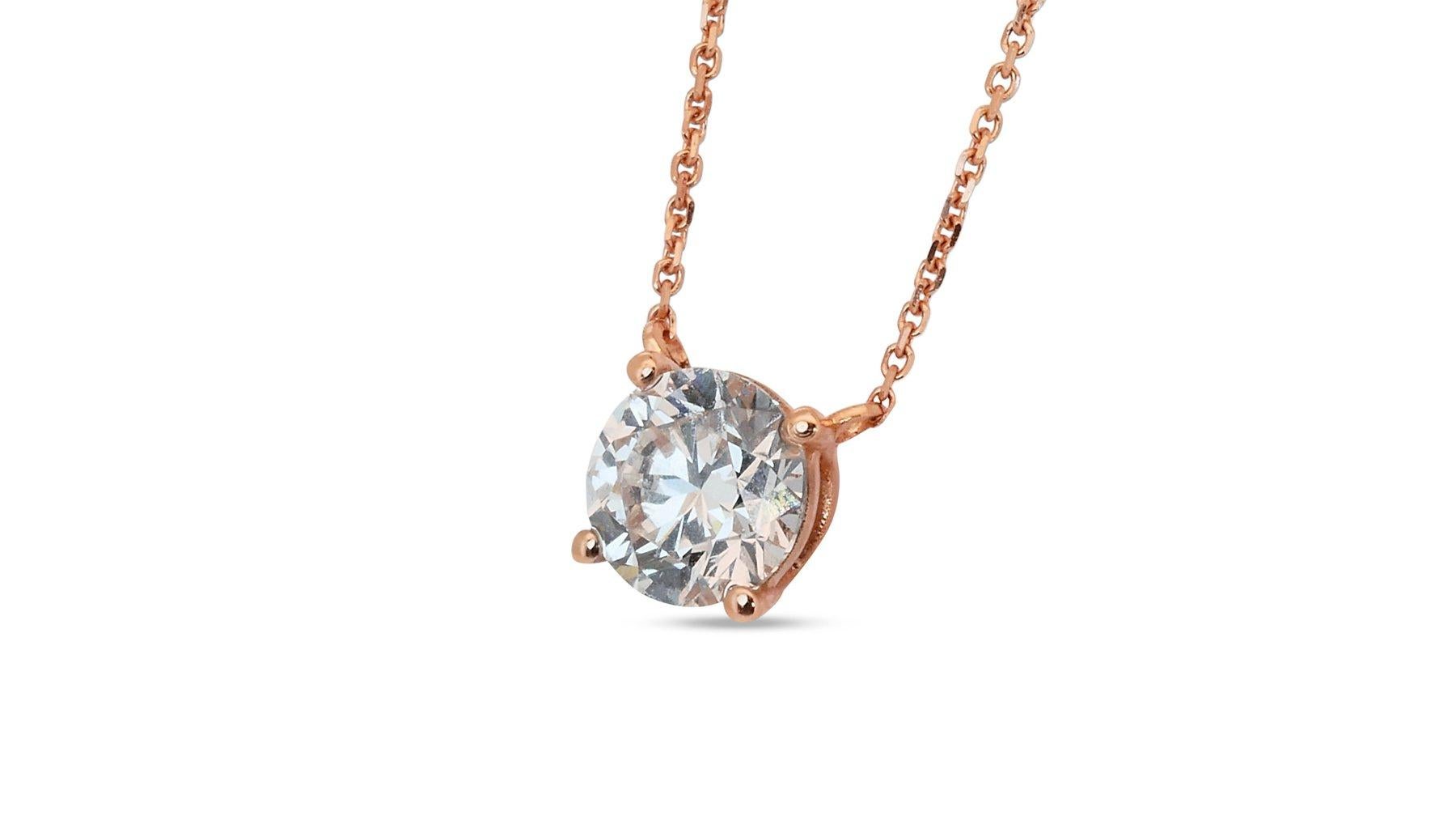 Beautiful 18K Rose Gold Ideal Cut Natural Diamond Necklace w/1.04ct - GIA Certified

This necklace is a captivating expression of luxury, showcasing a dazzling 1.04 carat natural diamond as its centerpiece. The delicate chain flatters any neckline,