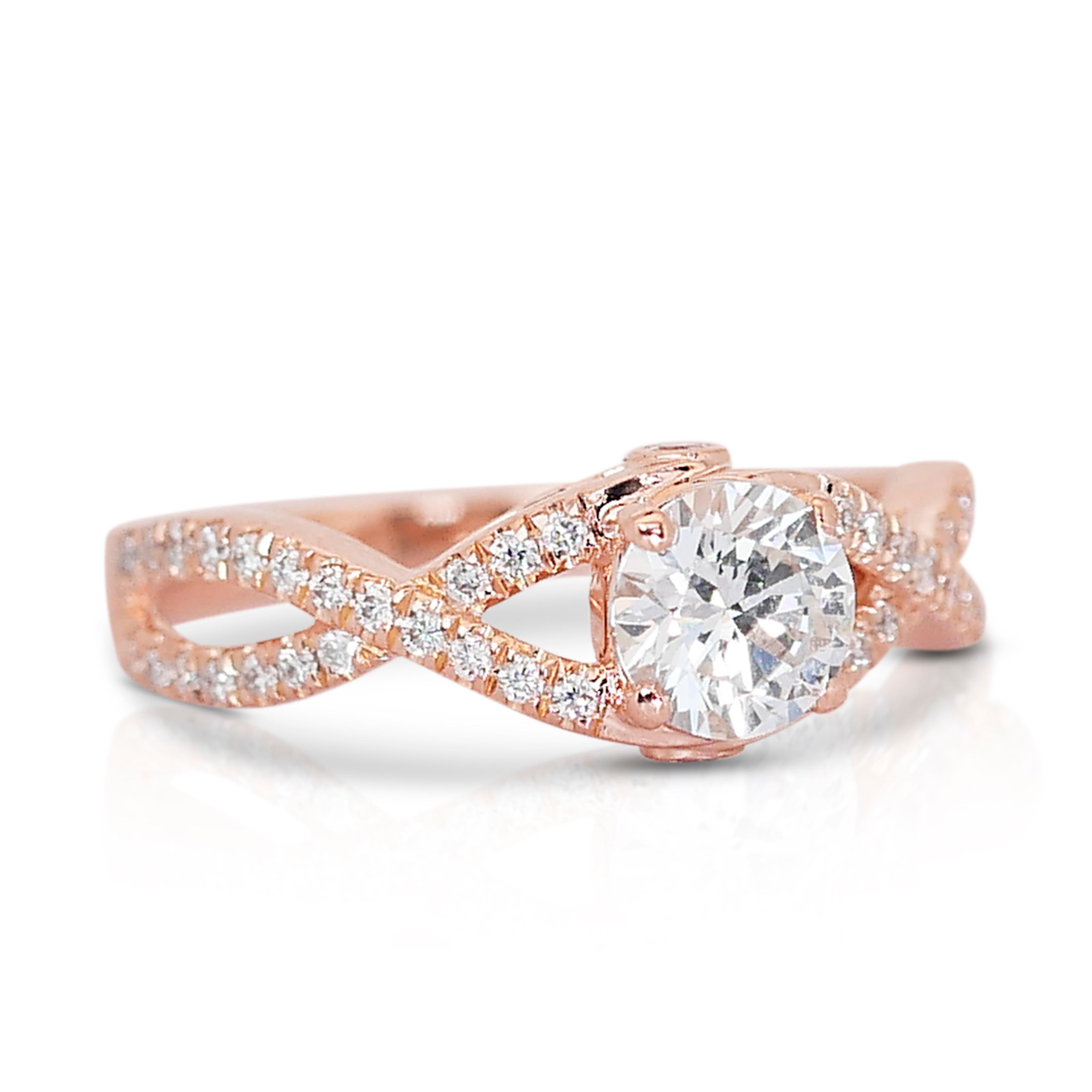 Beautiful 18K Rose Gold Infinity Natural Diamond Ring w/0.91ct 

Embrace infinite elegance with our lustrous 18K rose gold infinity diamond ring, a symbol of eternal love and sophistication. At its heart lies a brilliant main diamond, weighing 0.51