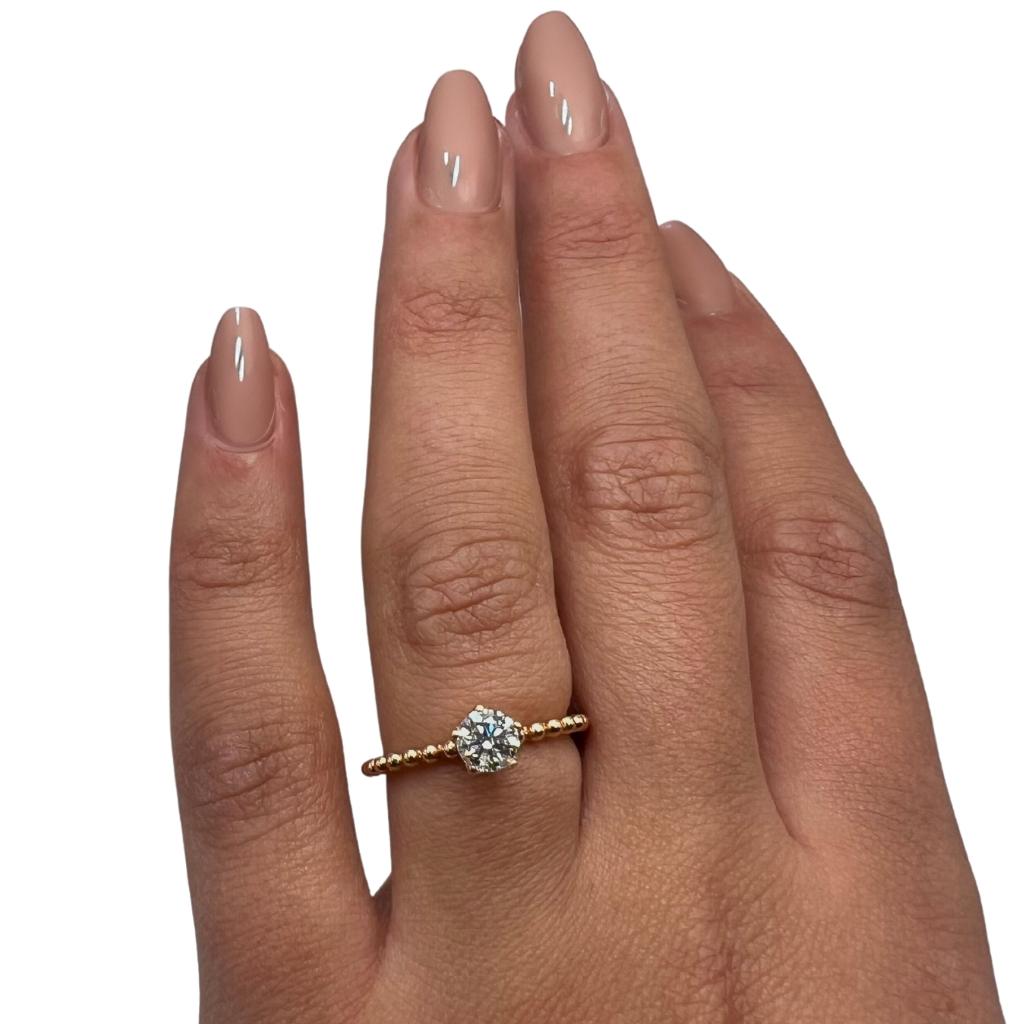 A classic stylish solitaire ring with a dazzling 0.4-carat round brilliant diamond. The jewelry is made of 18K Rose Gold with a high-quality polish. It comes with a GIA certificate and a fancy jewelry box.

1 diamond main stone of 0.4 carat
cut: