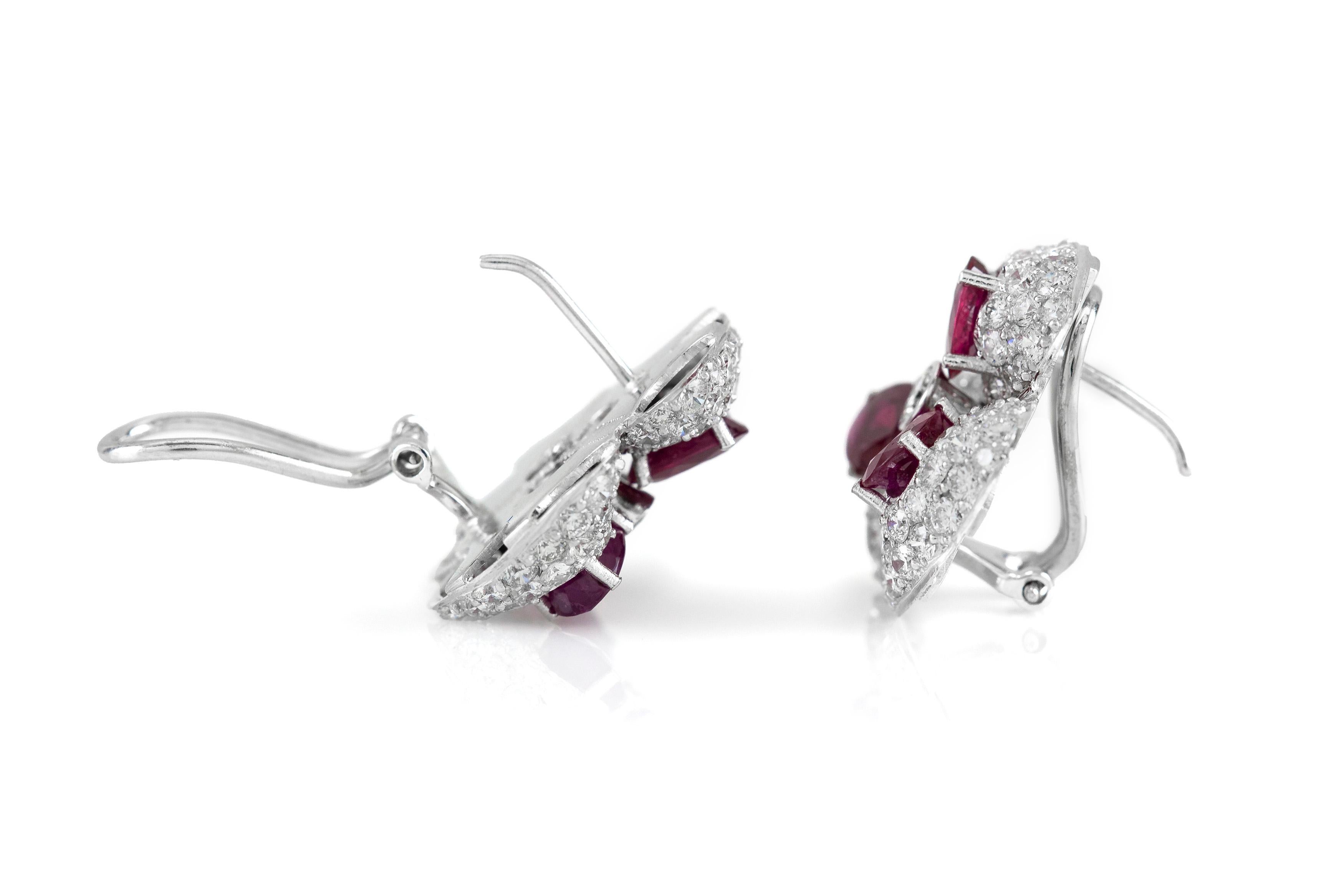 The earrings is finely crafted in 18k white gold with ruby weighing approximately total of 6.00 carat and diamonds weighing approximately total of 6.00 carat.