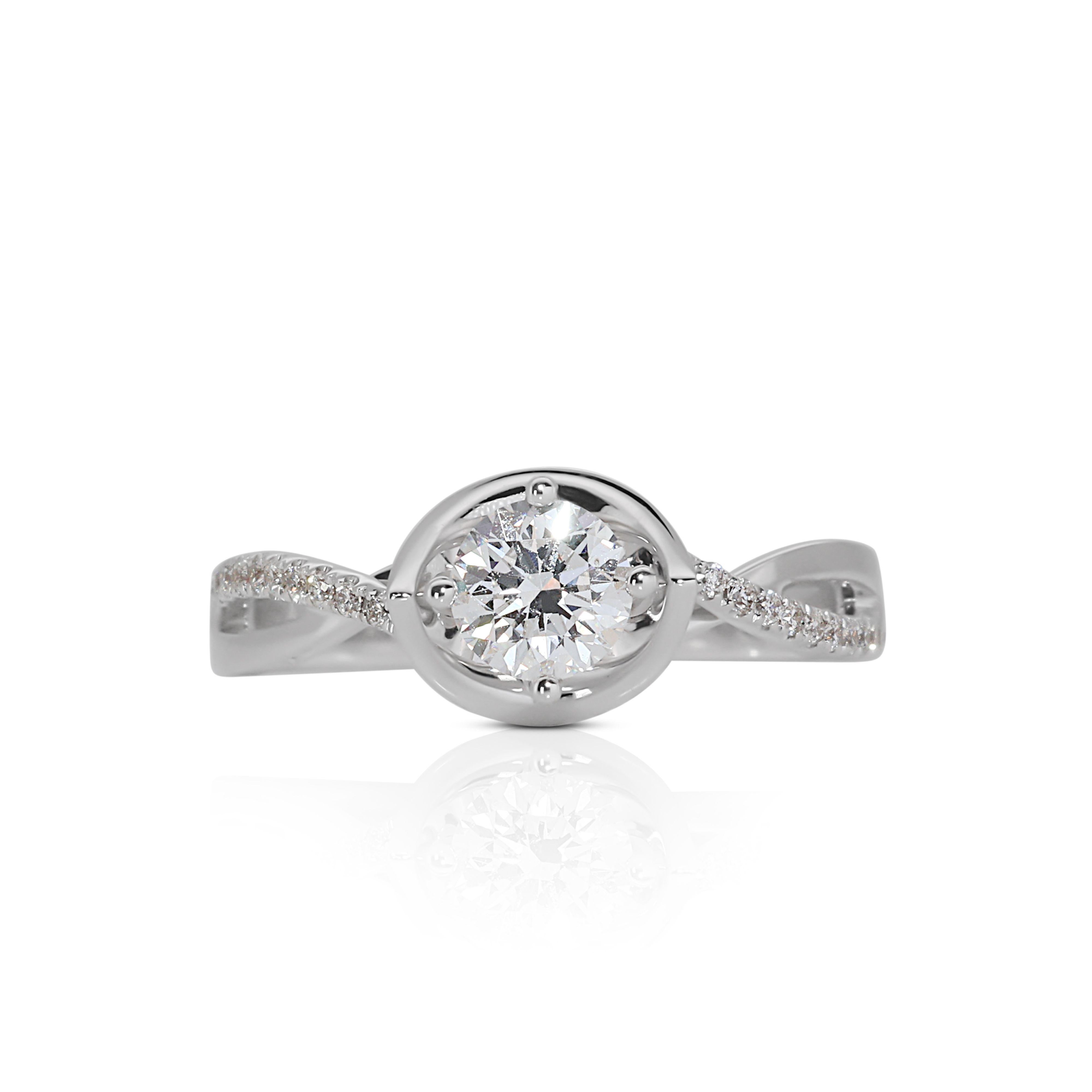 Beautiful 18K White Gold Halo Diamond Ring with 0.50ct Natural Diamond

This Beautiful 0.50ct Halo Diamond Ring in 18K White Gold is a truly mesmerizing and elegant piece of jewelry that seamlessly combines the timeless allure of a halo setting with