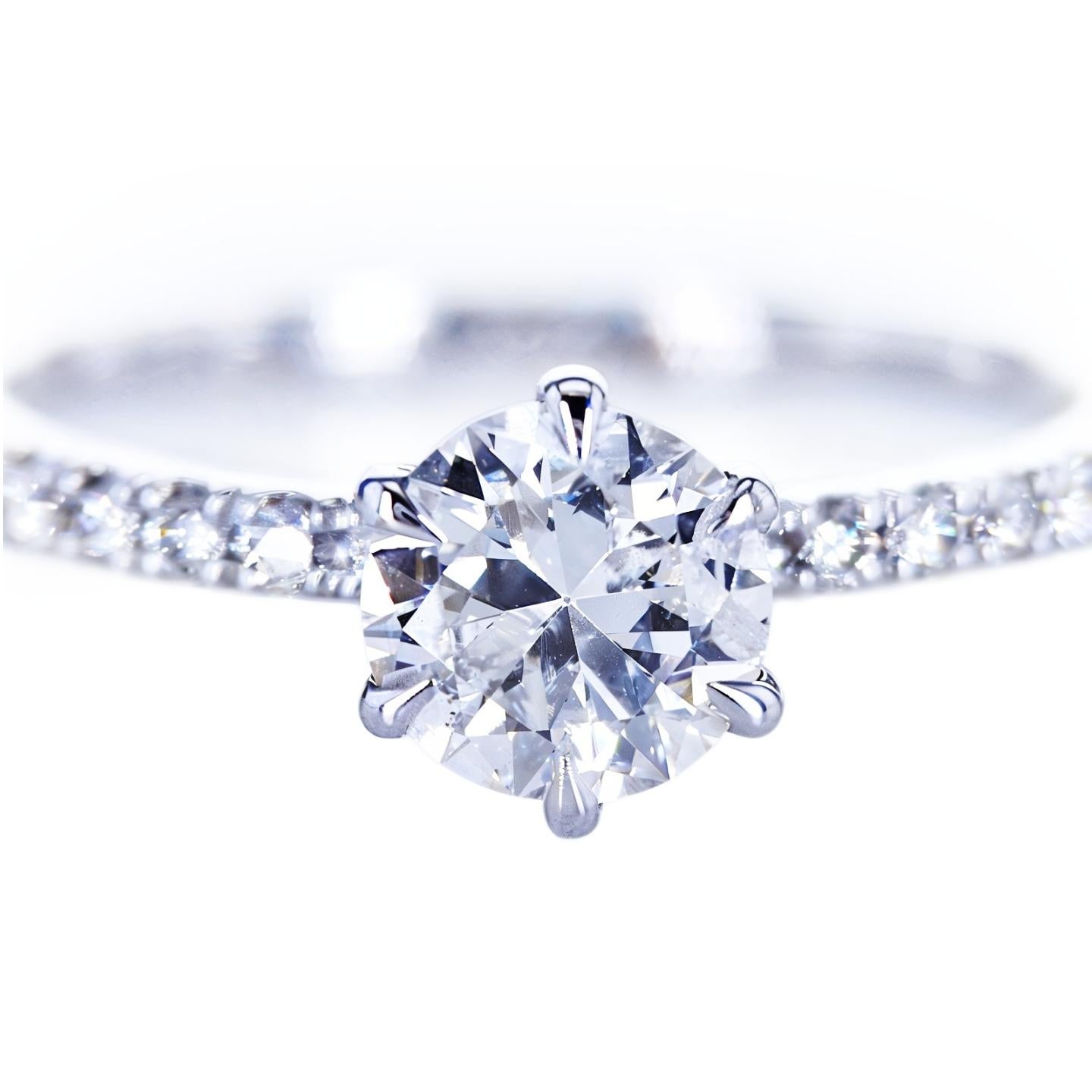Stunning 18K White Gold Ring with 0.92 Carat Natural Diamond and 0.28 Carat Accented Diamonds

18K White Gold, 2.15g (the gold has been tested by a professional)

Total Item Weight: 2.39 grams

This luxurious and high-quality crafted diamond ring is