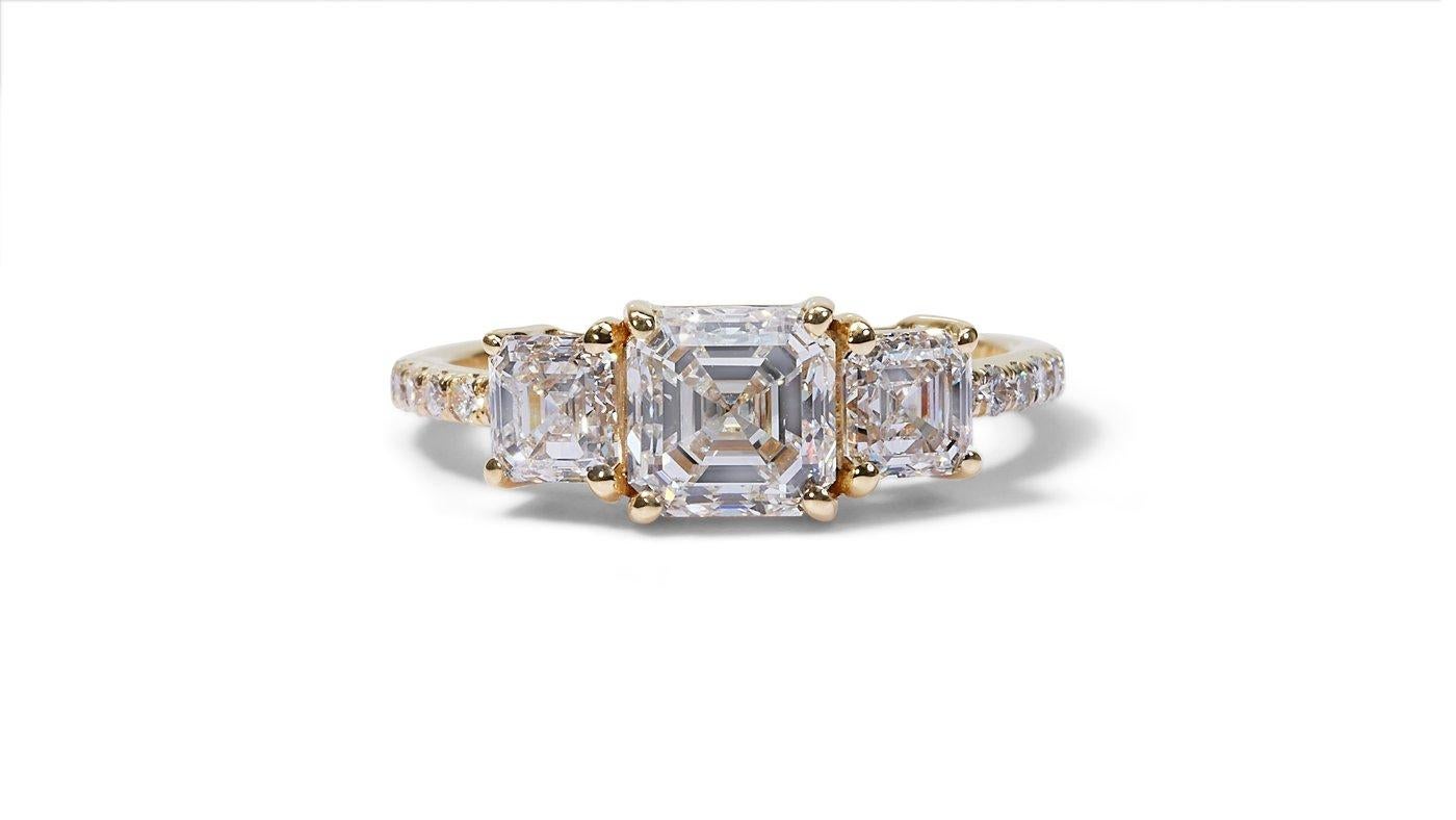 A beautiful Ring with a dazzling 1.51 carat Asscher natural Diamond. It has 1.14 carats of side diamonds which add more to its elegance. The jewelry is made of 18k Yellow Gold with a high quality polish. It comes with an AIG certificate and a fancy