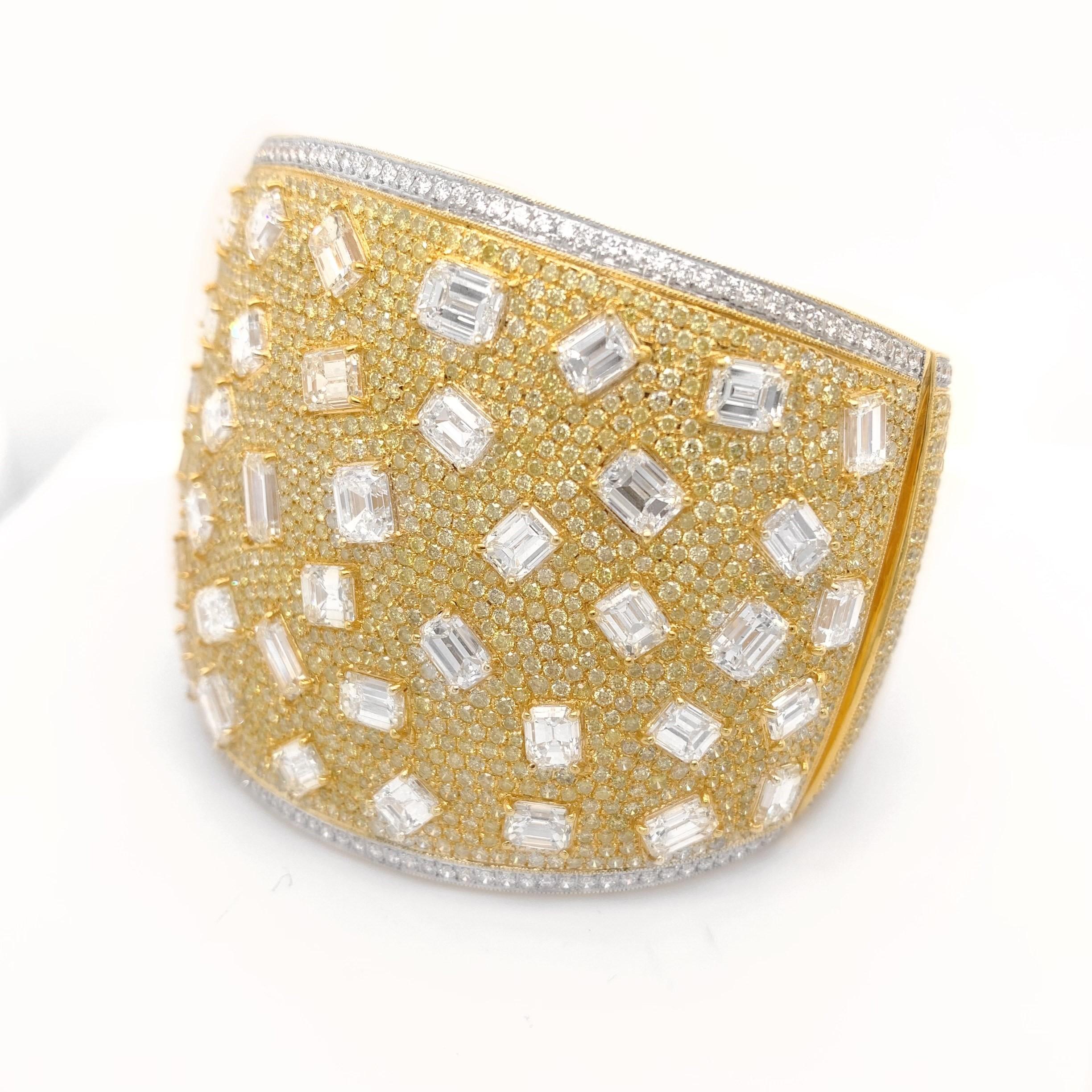 18K Yellow Gold Cuff with 25.74ct Rectangular Cut Diamonds,Surrounded by total weight of 2.51ct Round Diamonds and 34.65ct Yellow Diamonds.

Sophia D by Joseph Dardashti LTD has been known worldwide for 35 years and are inspired by classic Art Deco