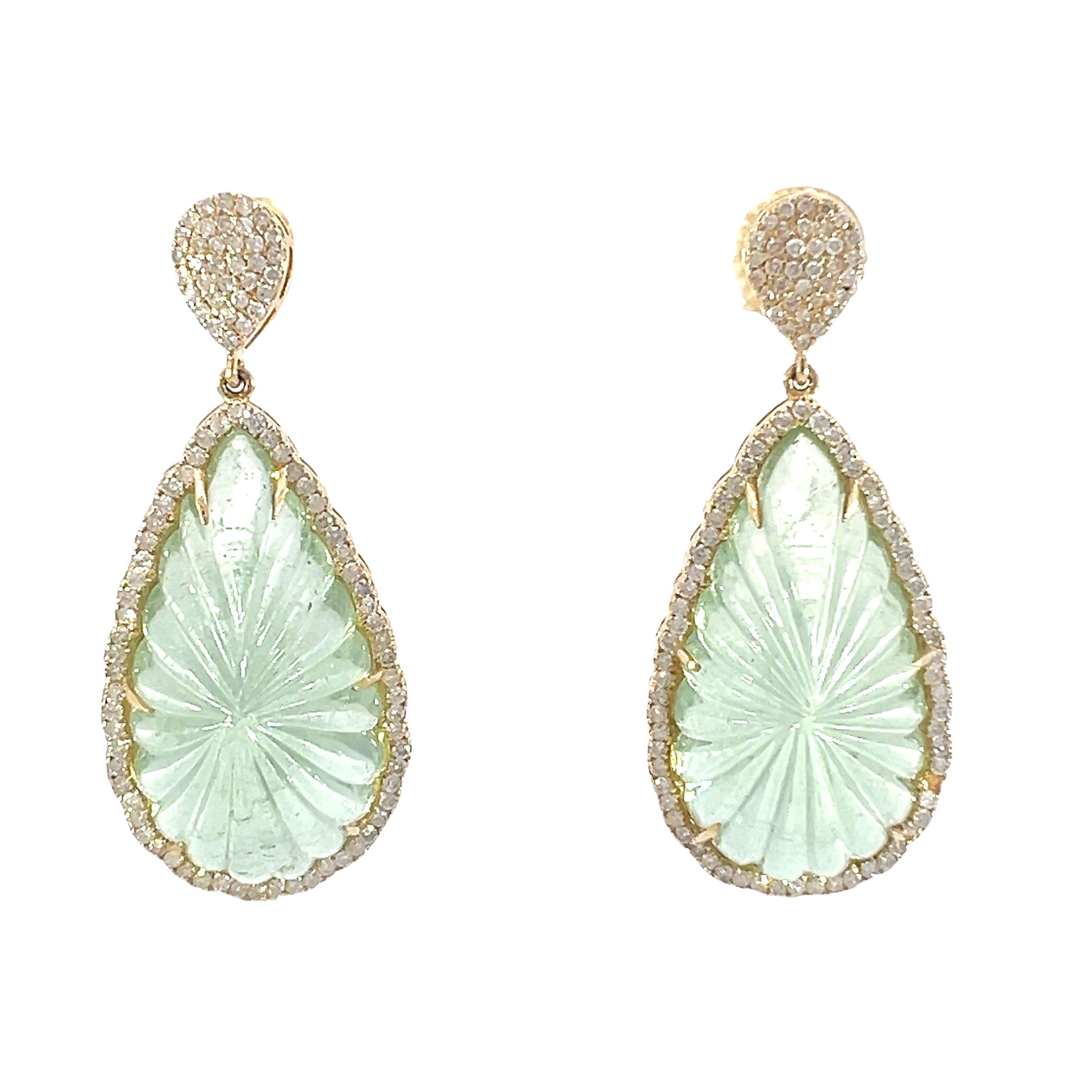 An magnificent set of 58.87-carat natural green aquamarine and 1.64-carat diamonds are set in 18-karat yellow gold. The centerpiece of these magnificent teardrop earrings is a gorgeous green aquamarine that has been flawlessly carved. Sparkling