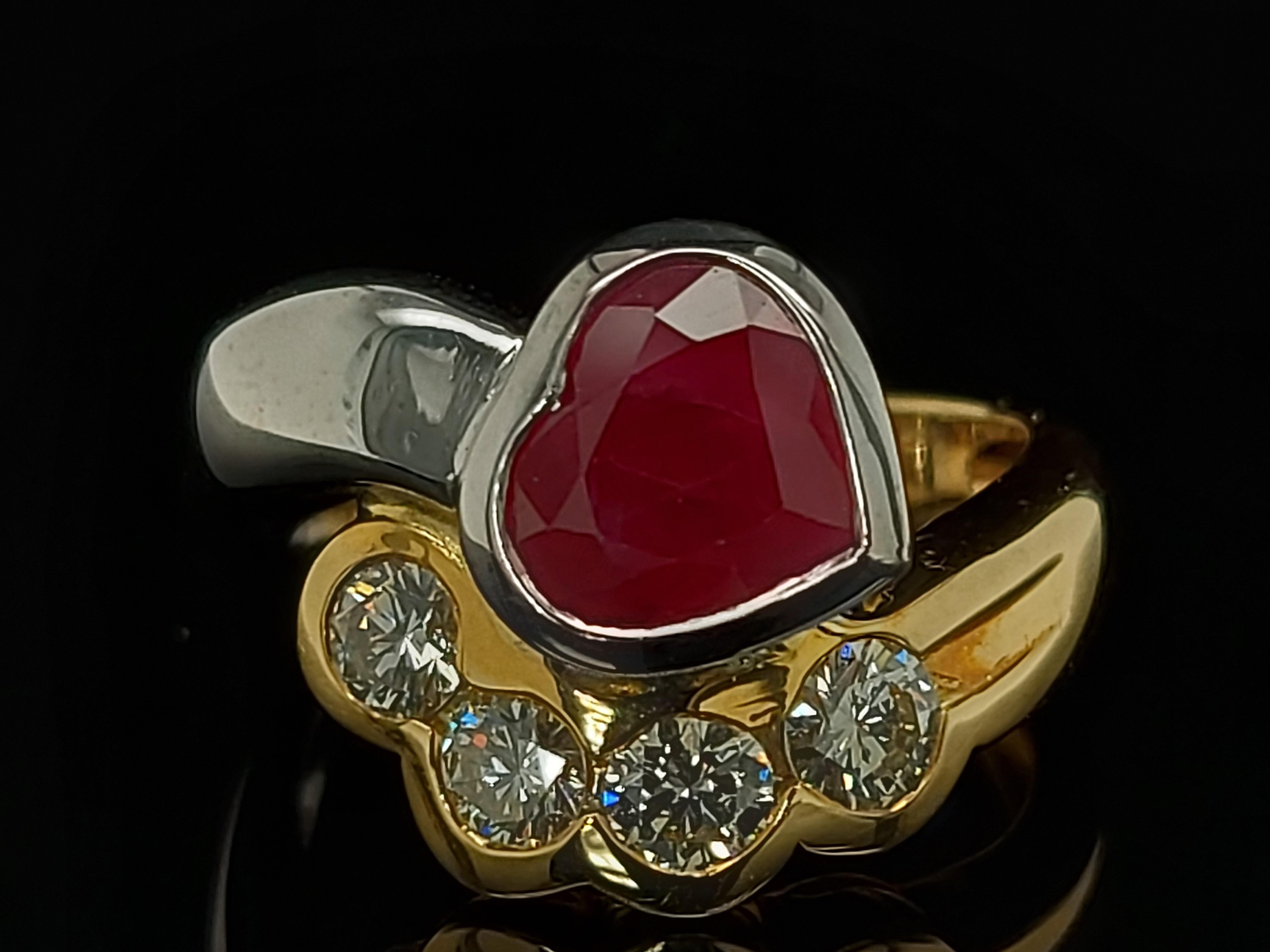 Beautiful 18kt yellow and white gold ring with 4 diamonds and heart shaped ruby

Diamonds: 4 brilliant cut diamonds, together 0.60 cts

Ruby : Heart Shape ca. 2,5 ct

Material: 18kt white and yellow gold

Total weight: 8.4 grams / 0.295 oz / 5.4