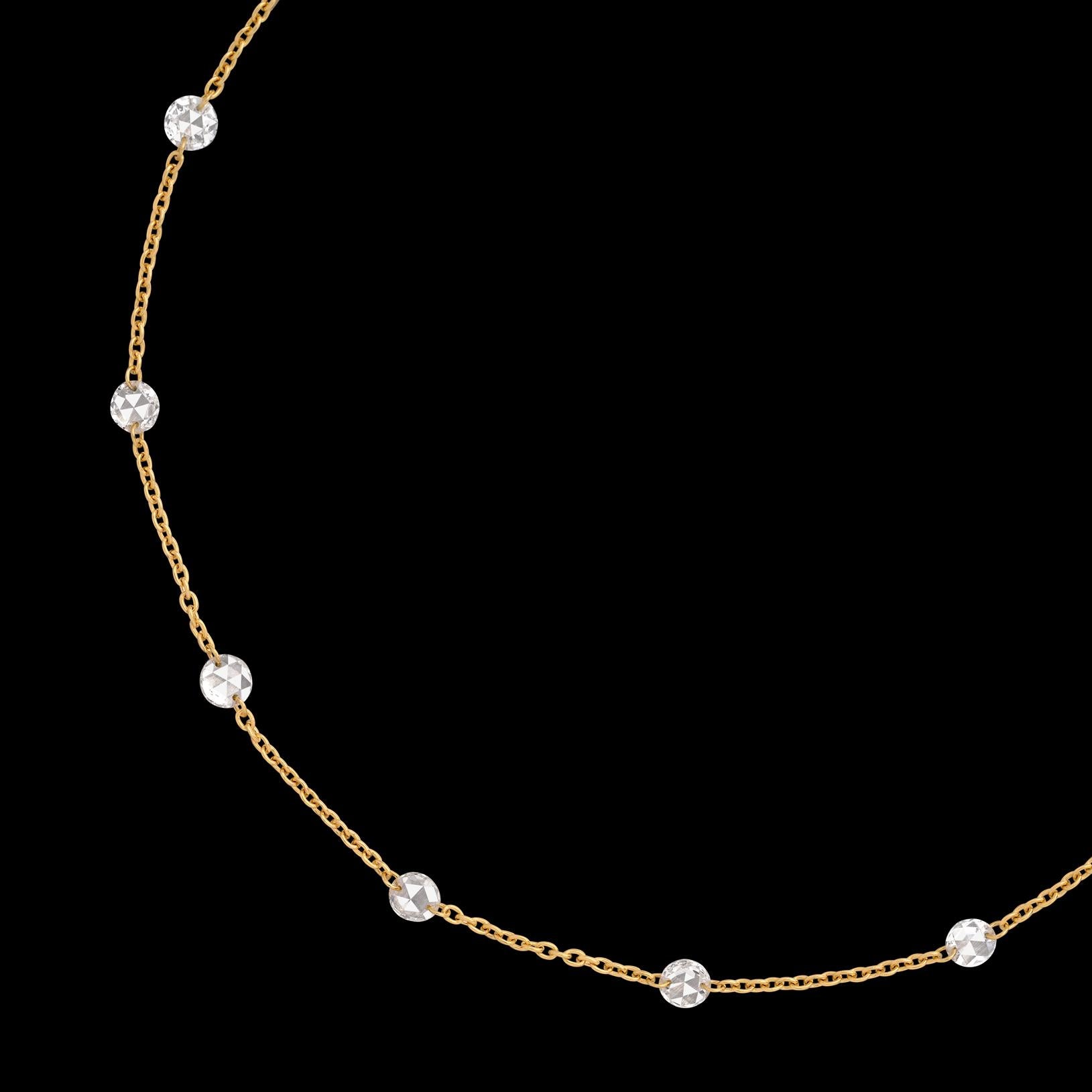 Your new favorite necklace! This 18 karat yellow gold beauty features 25 fine cut round diamonds weighing a total of 1.65 carats. These unique, multi-faceted diamonds have been drilled through so that the gold chain is woven directly between the