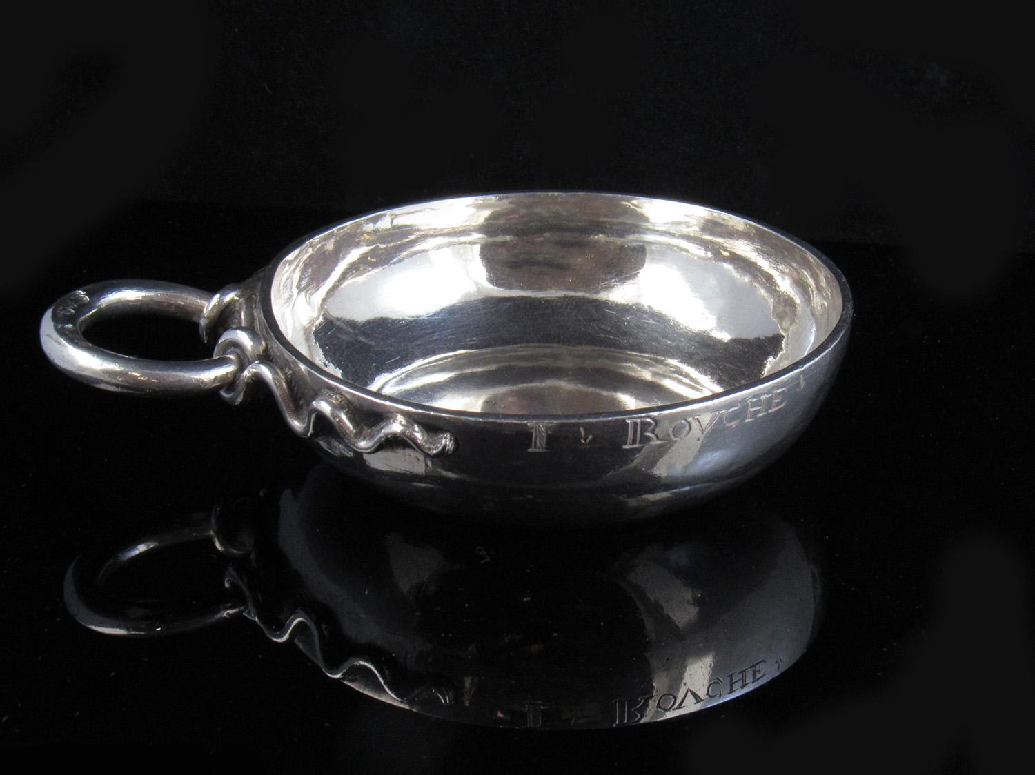 A particularly good quality heavy gauge solid silver French wine taster.  The beautiful plain bowl and entwined serpent handle which doubles as hook for hanging up or wearing on a chain.

Weight 76 grams, 2.44 troy ounces.

Stamped to base and to