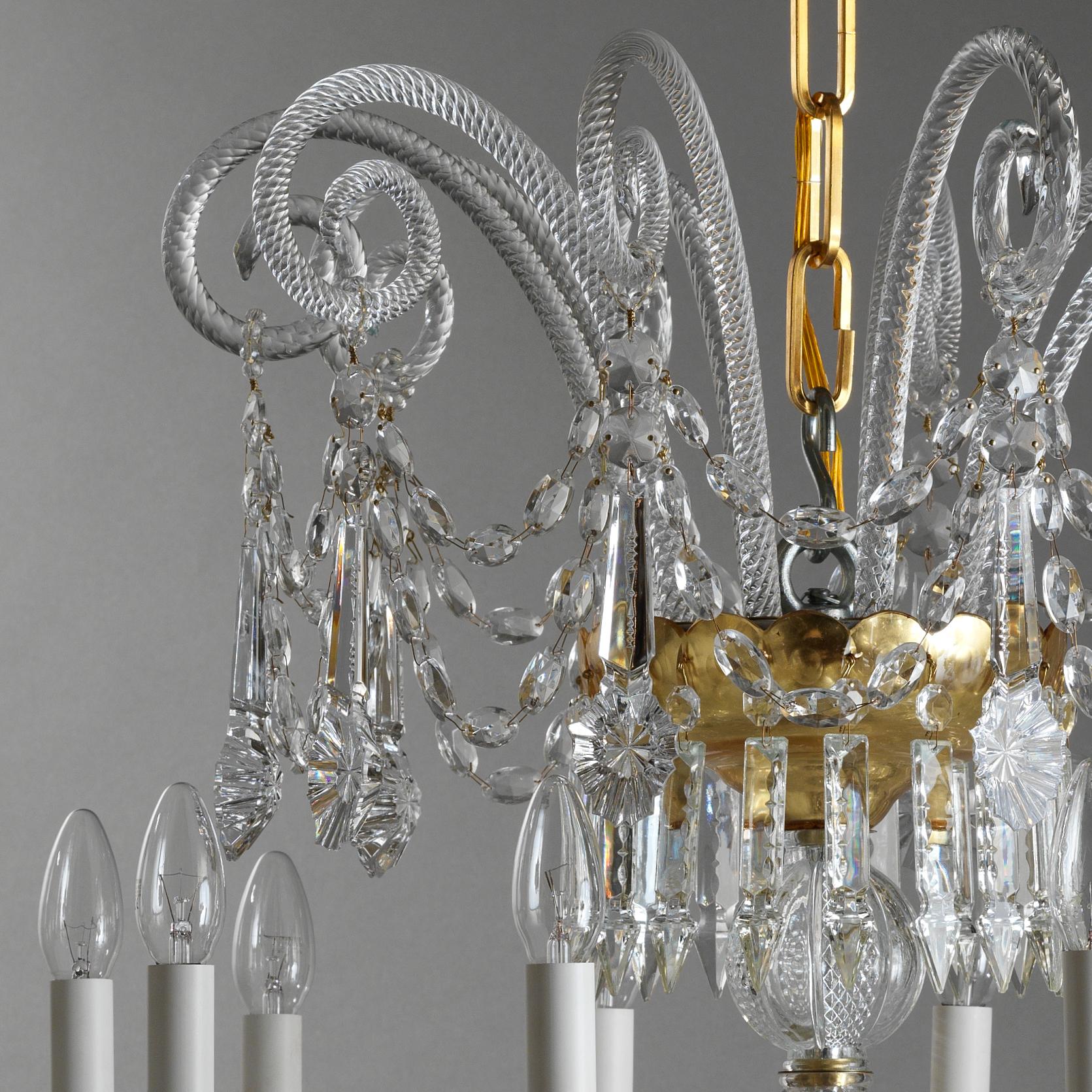 This 18th Century Style Crystal and Blown Glass Chandelier by Gherardo Degli Albizzi, is made in transparent color with gilded cups. This chandelier is composed by three branch layers. Top crown pastorals from which many bohemian crystal festoons
