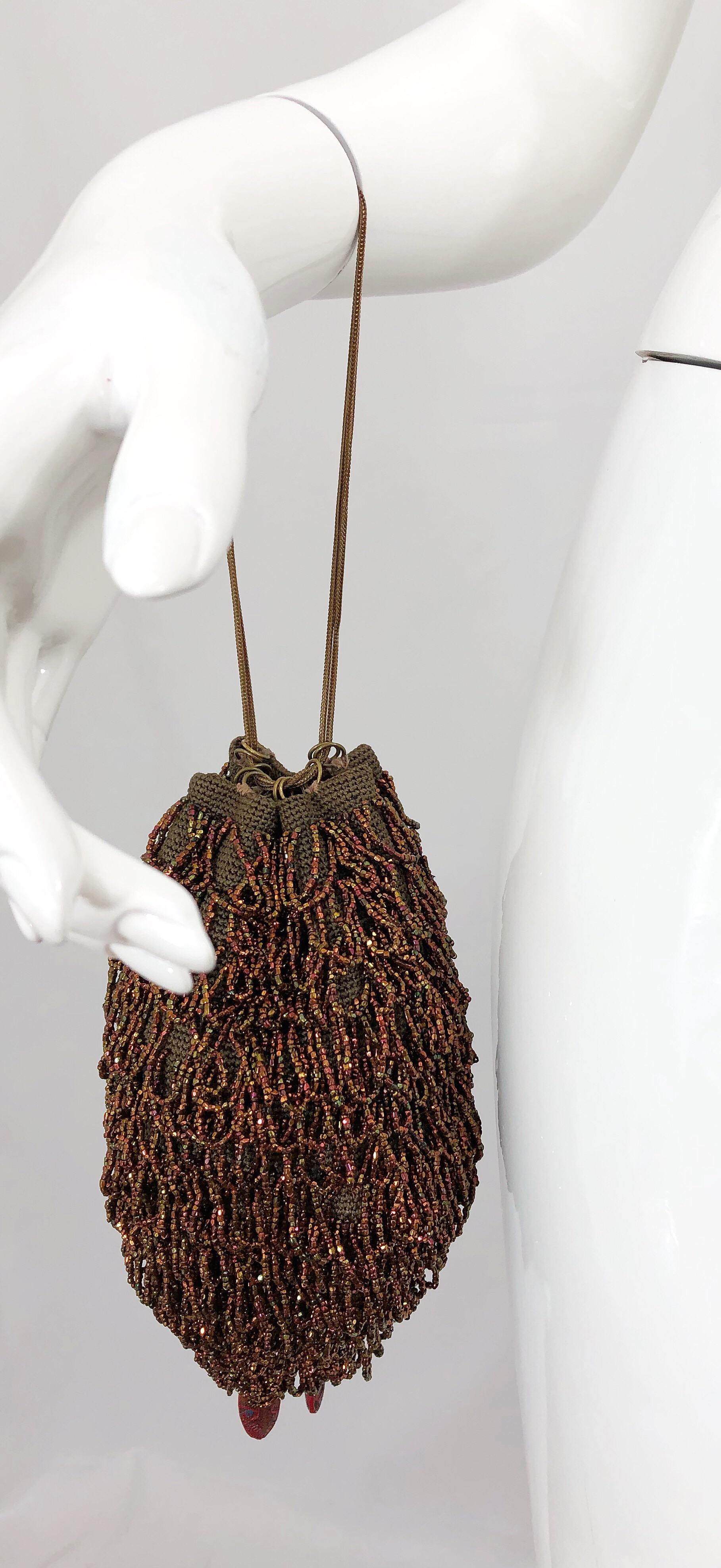 Beautiful 1920s bronze and brown fully beaded evening bag! The perfect alternative to a clutch! This rare gem features two gold metal chains, and can be adjusted to wear long or short. The perfect size that can easily fit a smartphone, some makeup