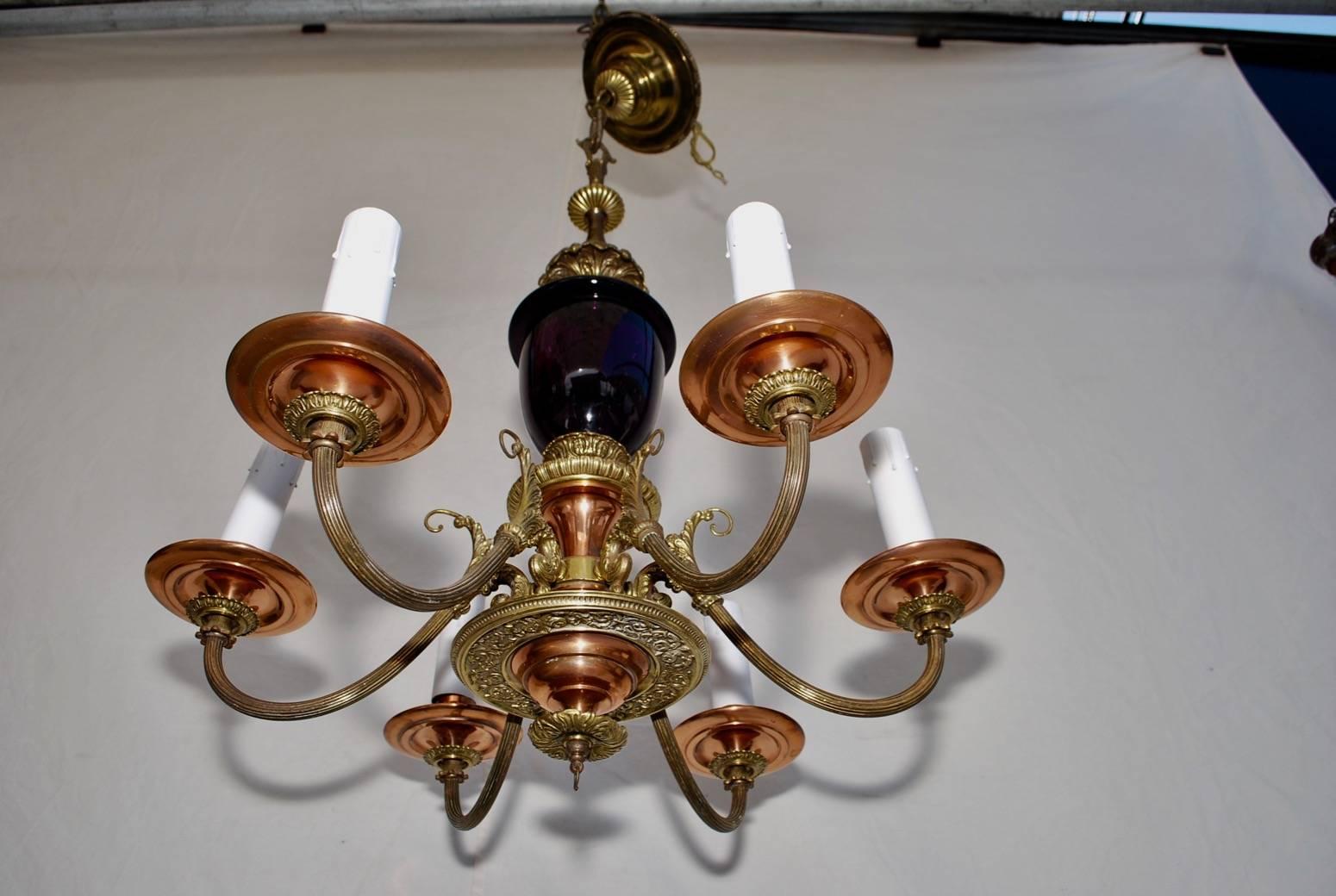 A beautiful 1930 chandelier, the purple glass look amazing when they is a window behind the chandelier.

     
