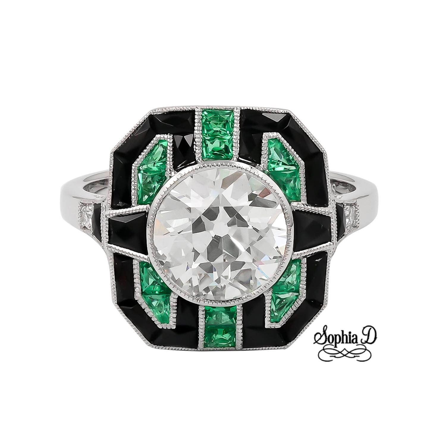 Sophia D ring composed of diamonds, onyx, and emeralds. It features a round cut diamond center that weighs approximately 1.94 carats and is accented with 0.95 carats onyx and .30 carats emerald in platinum setting.

The ring size is 6.5 and