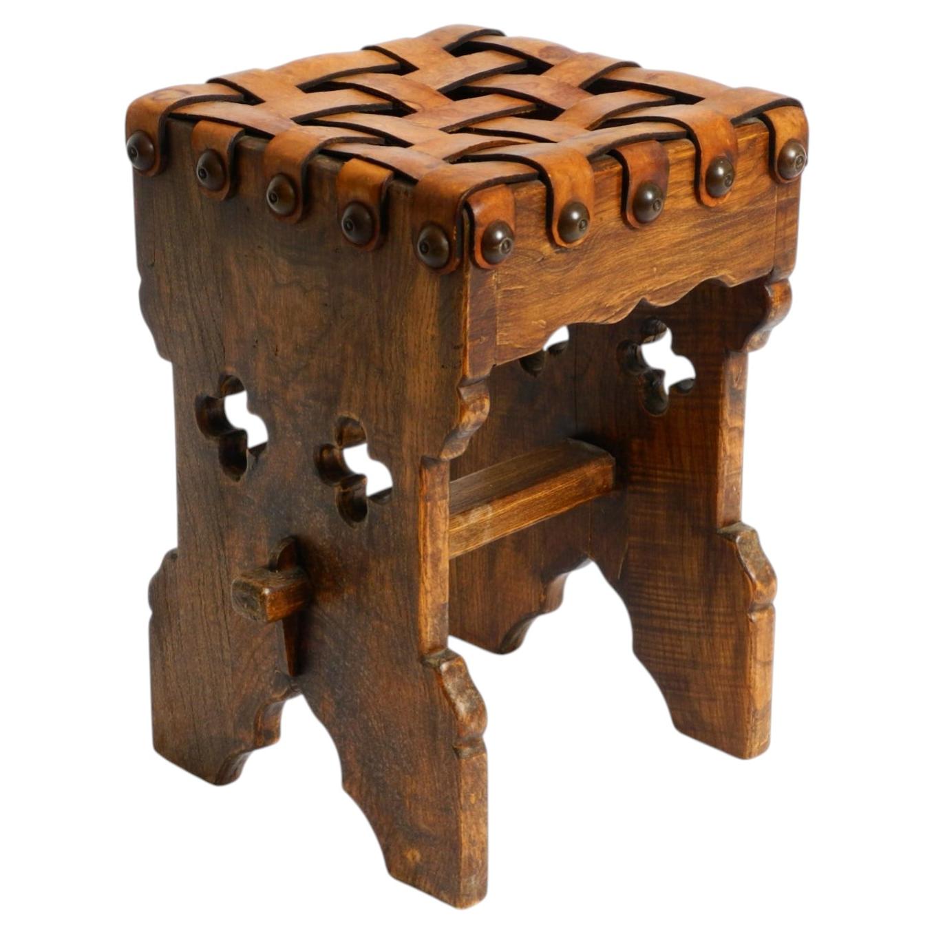Beautiful 1940s oak stool with a seat made of leather straps
