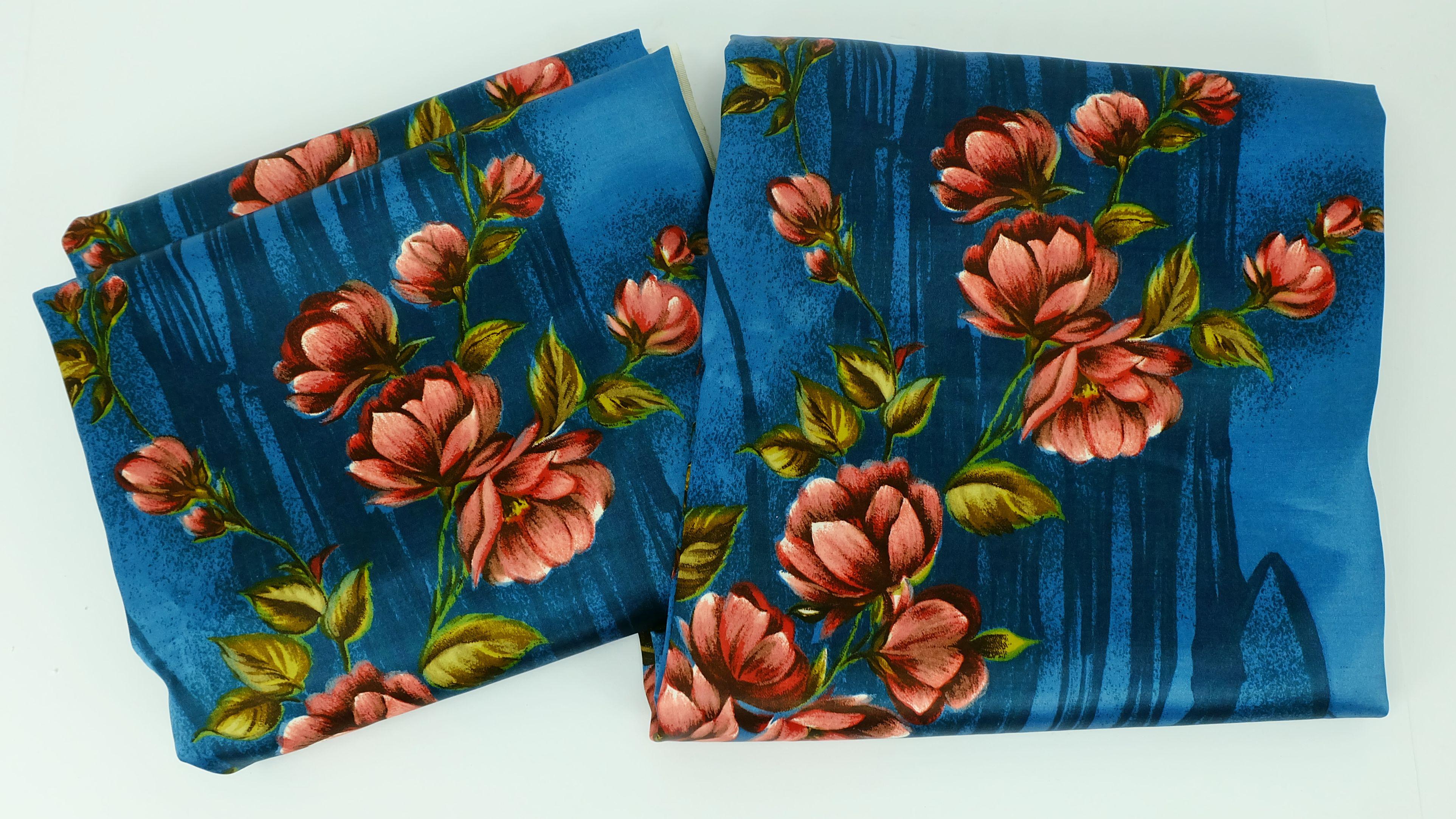 2 pieces of original 1950s fabric with a large flower pattern on a blue and black background. Material is heavy drape satin. Suitable for curtains. The last photo shows a full length panel, both panels are identical in pattern sequence.