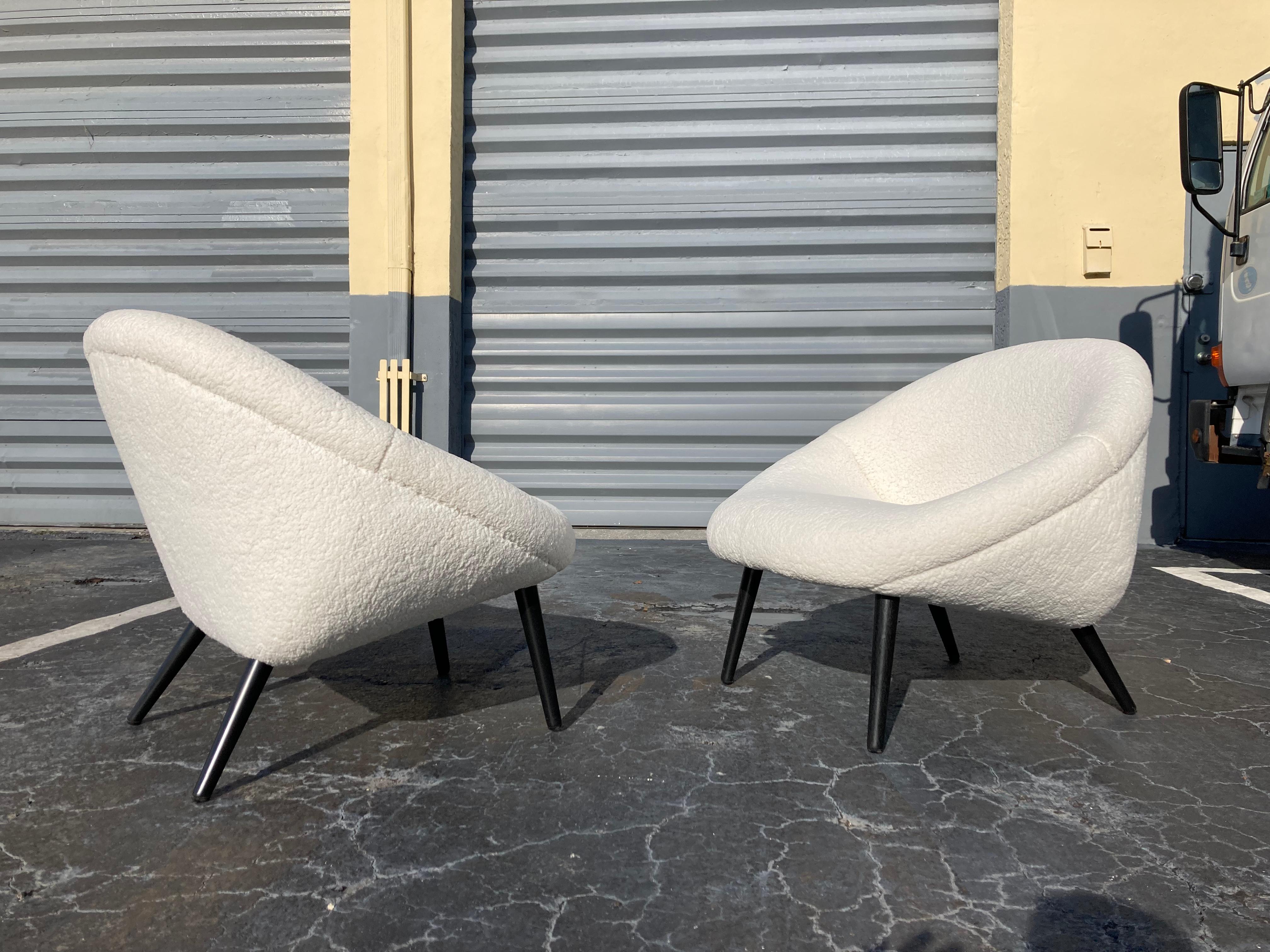 Original 1950s lounge chairs, faux sheepskin and black painted wood legs. Faux sheepskin is in good condition. Each chair comes with a pillow. Please see all pictures.