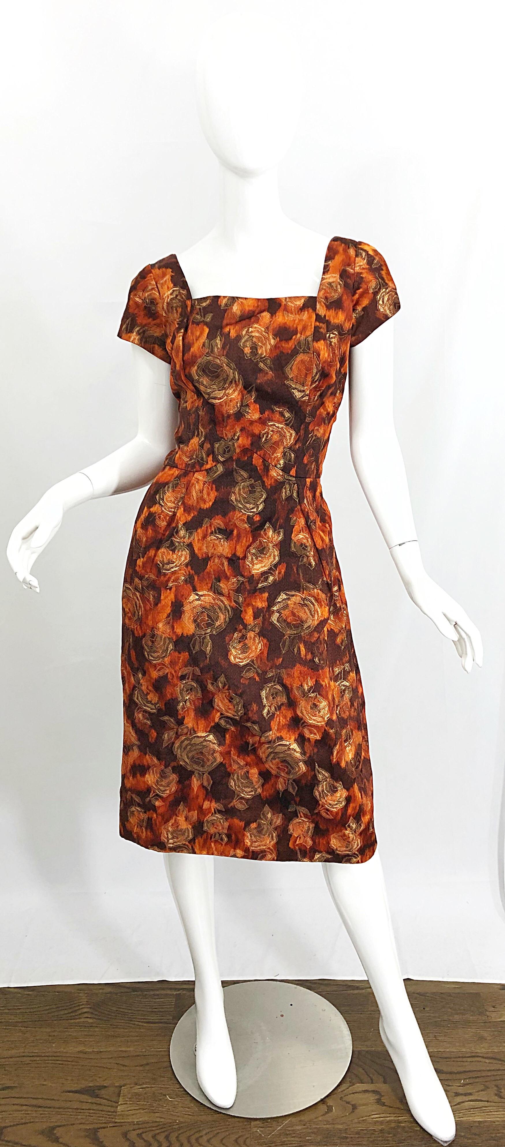 Chic 1950s demi couture rose print silk brocade dress AND jacket ensemble! Features a beautiful fabric with autumnal colors of brown, burnt orange and gold throughout. Pillbox jacket has 3/4 length sleeves, with buttons and snap closures. Short