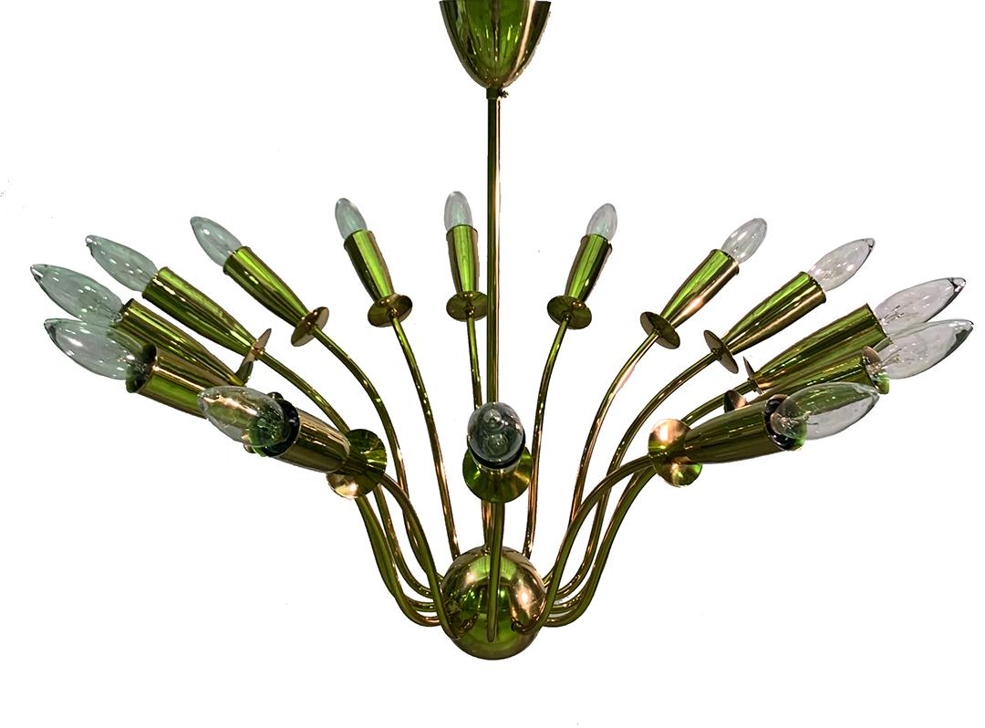 This beautiful 1950s spider sputnik chandelier features a 14 arms brass frame bursting from a central sphere. The piece has been fully polished and rewired to American standards.

Made in Germany, circa 1950.
