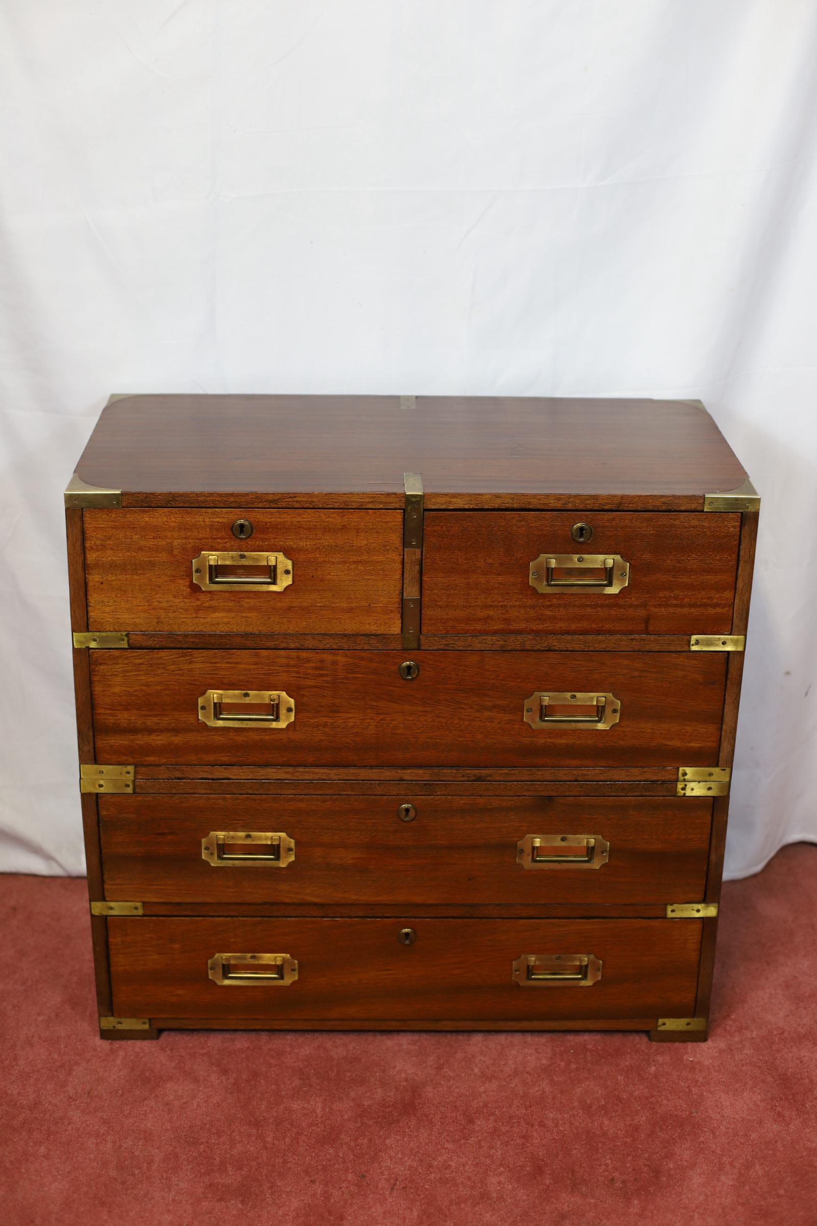 We delight to offer for sale this stunning military campaign style chest of five drawers with brass inset handles and brass mounts , the piece separates into upper and lower halves , lovely condition !
Don't hesitate to contact me if you have any