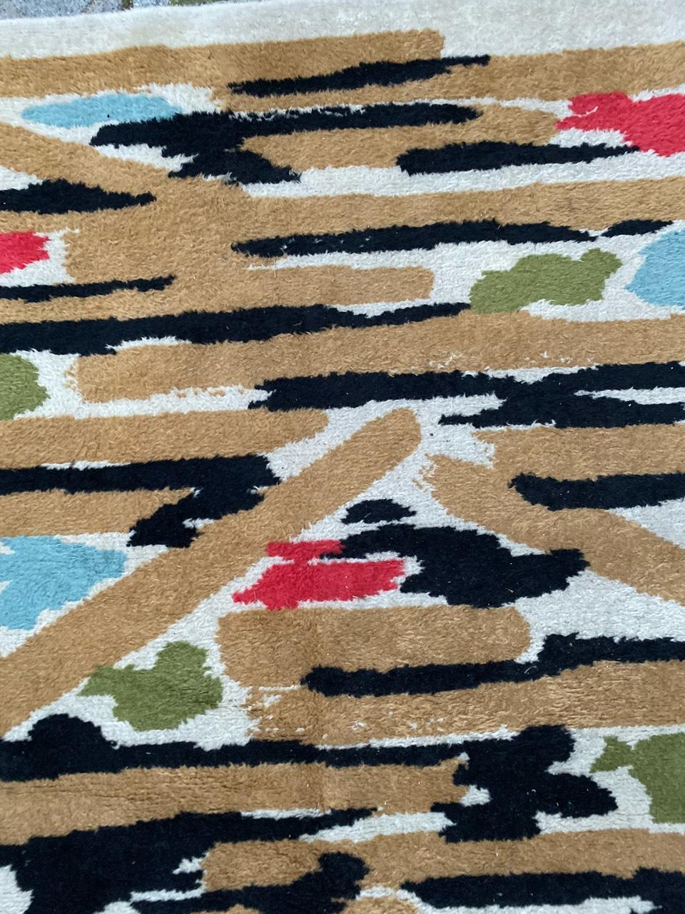 Wonderful original French mid-20th century modern rug, with beautiful abstract design and nice colors with pink, yellow, black, blue and green, entirely hand knotted with wool velvet on cotton foundation.
Made in France or Morocco in order.