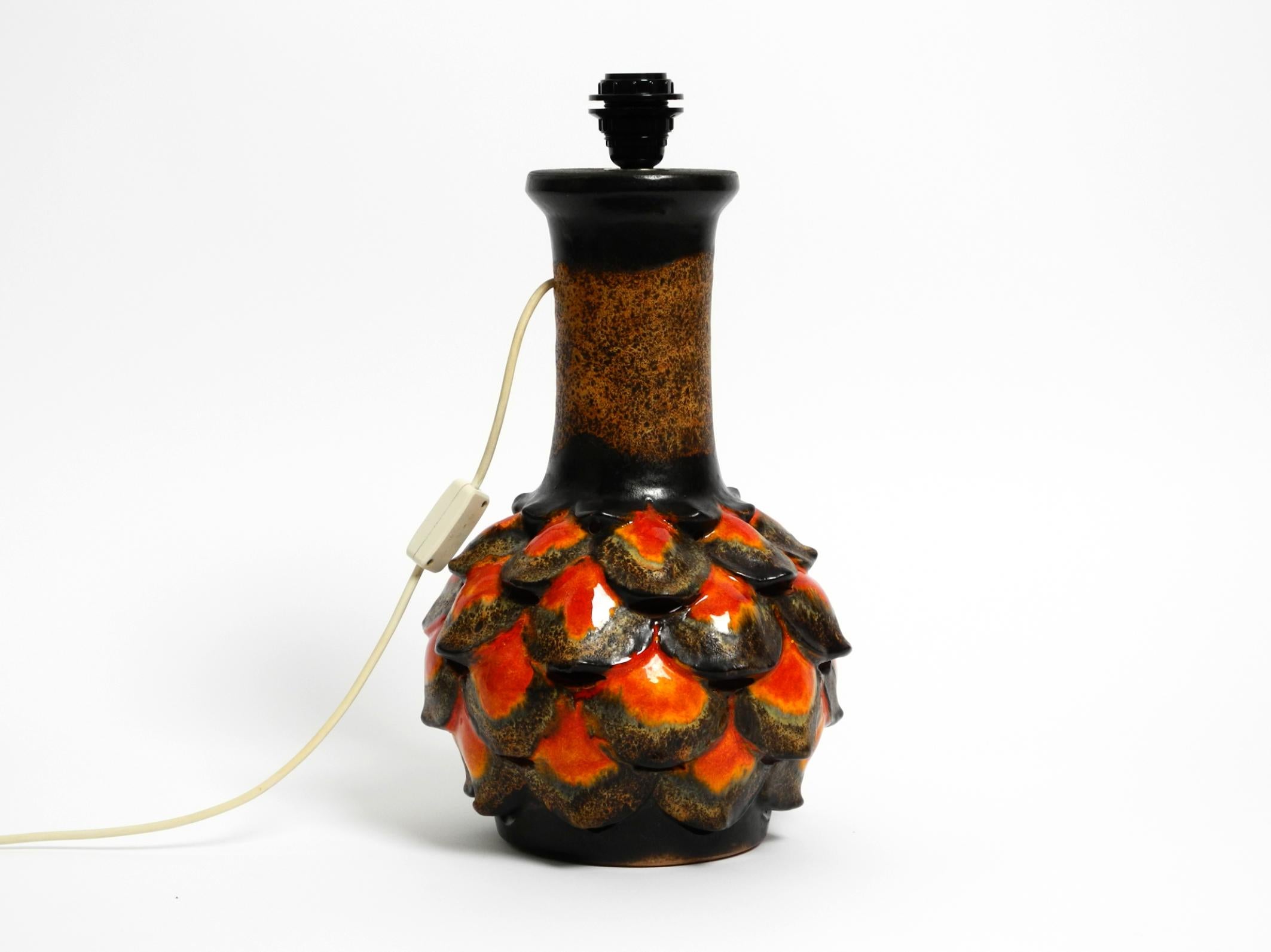 Beautiful 1960s large ceramic table lamp by Walter Gerhards for Aro Leuchten.
Walter Gerhards was the founder and artistic director of Walter Gerhards KG. Made in Germany.
High-quality lamps, vases and many different decorative items were made from