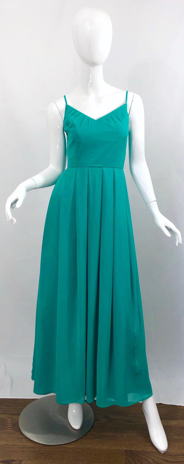 Beautiful mid 1970s teal green / blue aqua silk chiffon demi couture maxi dress / gown ! Words cannot even begin to convey the level of workmanship on this beauty. Sleeveless bodice, with strategically placed gathers that both elongate and flatter