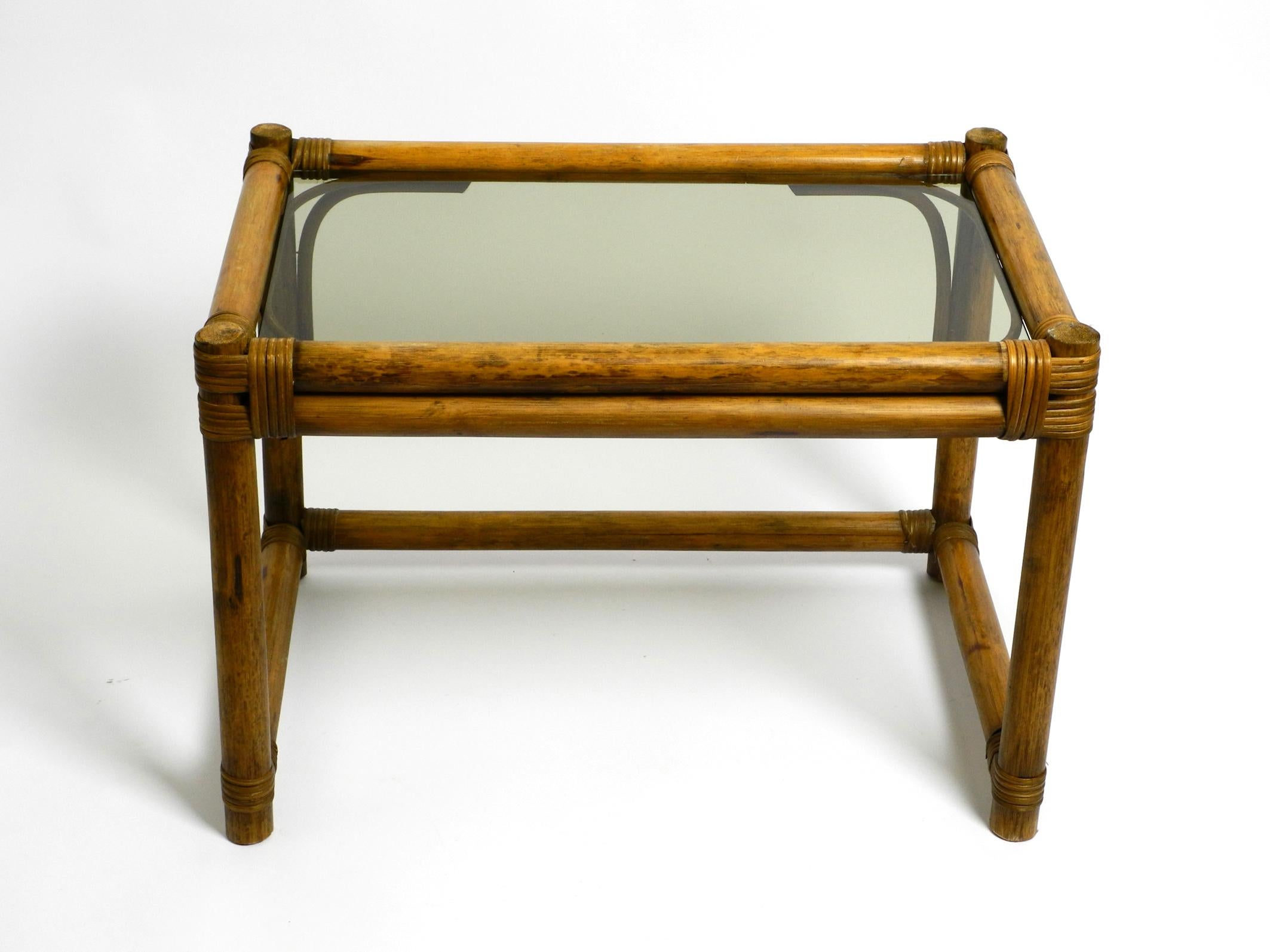Beautiful 1970s dark bamboo wood couch or side table with smoked glass top For Sale 11