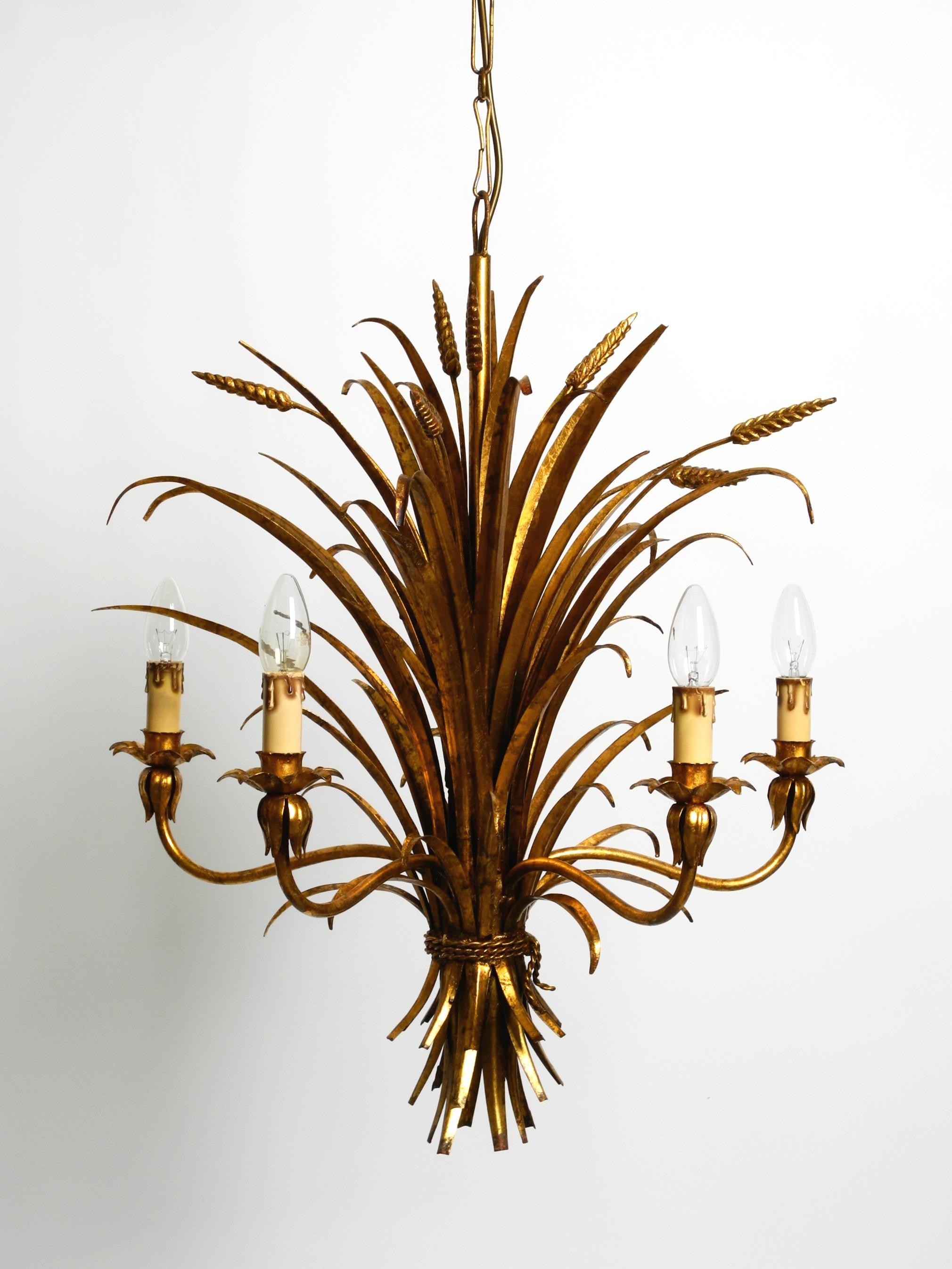 Regency Beautiful 1970s gold-plated 5-arm tall metal chandelier by Hans Kögl For Sale