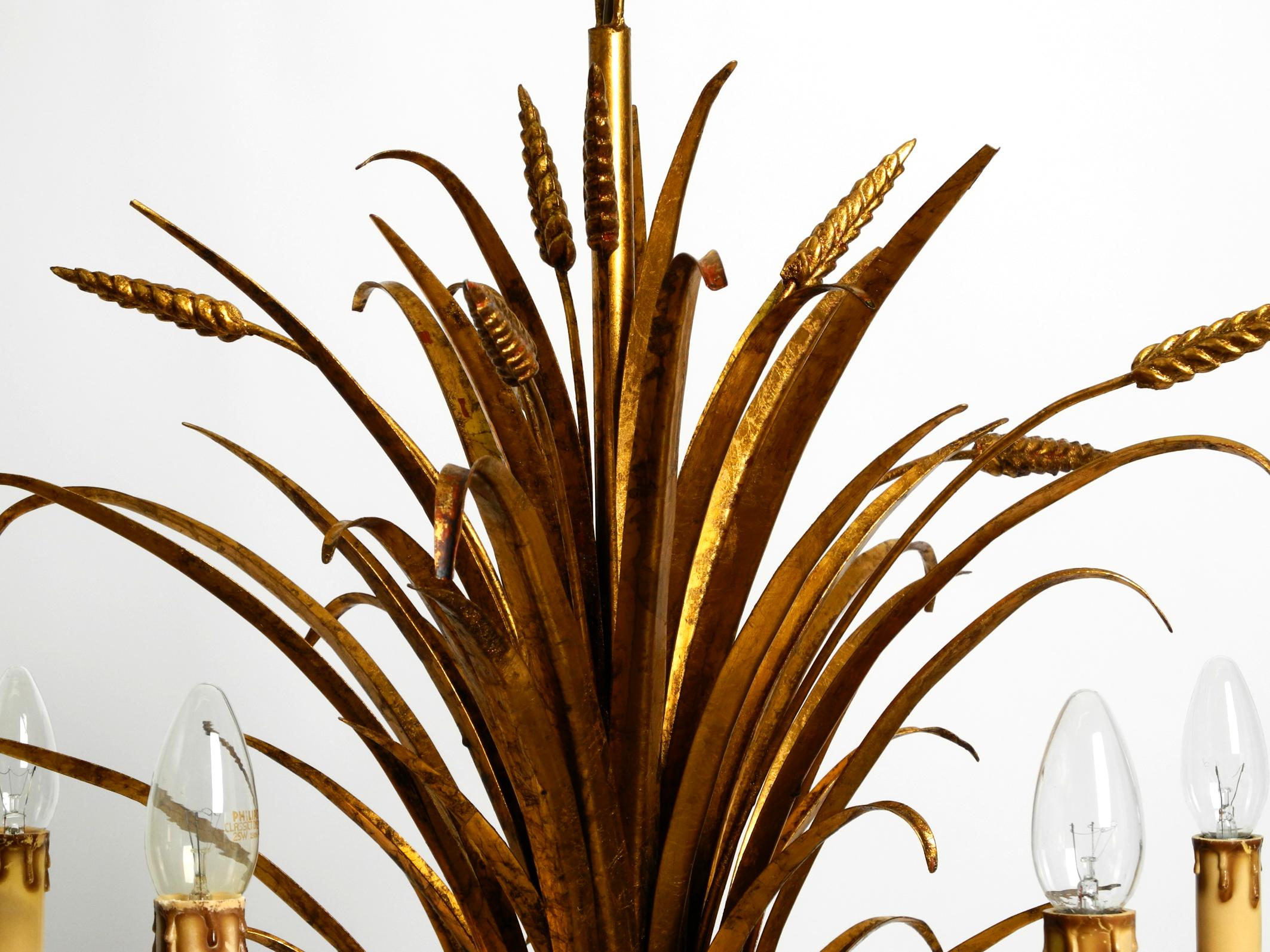 Metal Beautiful 1970s gold-plated 5-arm tall metal chandelier by Hans Kögl For Sale