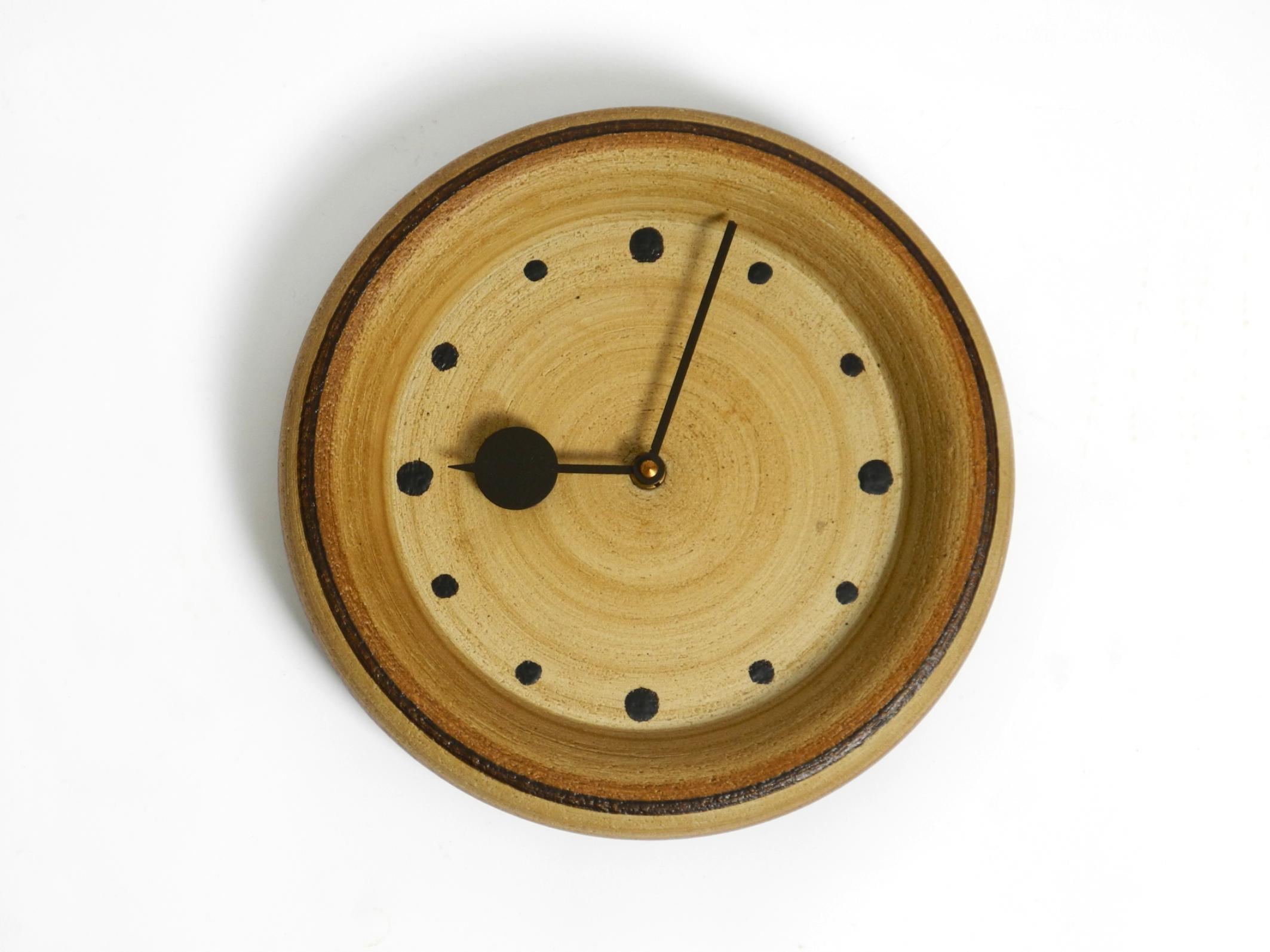 Beautiful round ceramic wall clock from 1970s.
Very high-quality and beautifully crafted in rich brown tones. Typical to the period.
Handmade. Made in Germany.
Battery-operated. The mechanism has been replaced by a modern one.
Fully functional. Runs