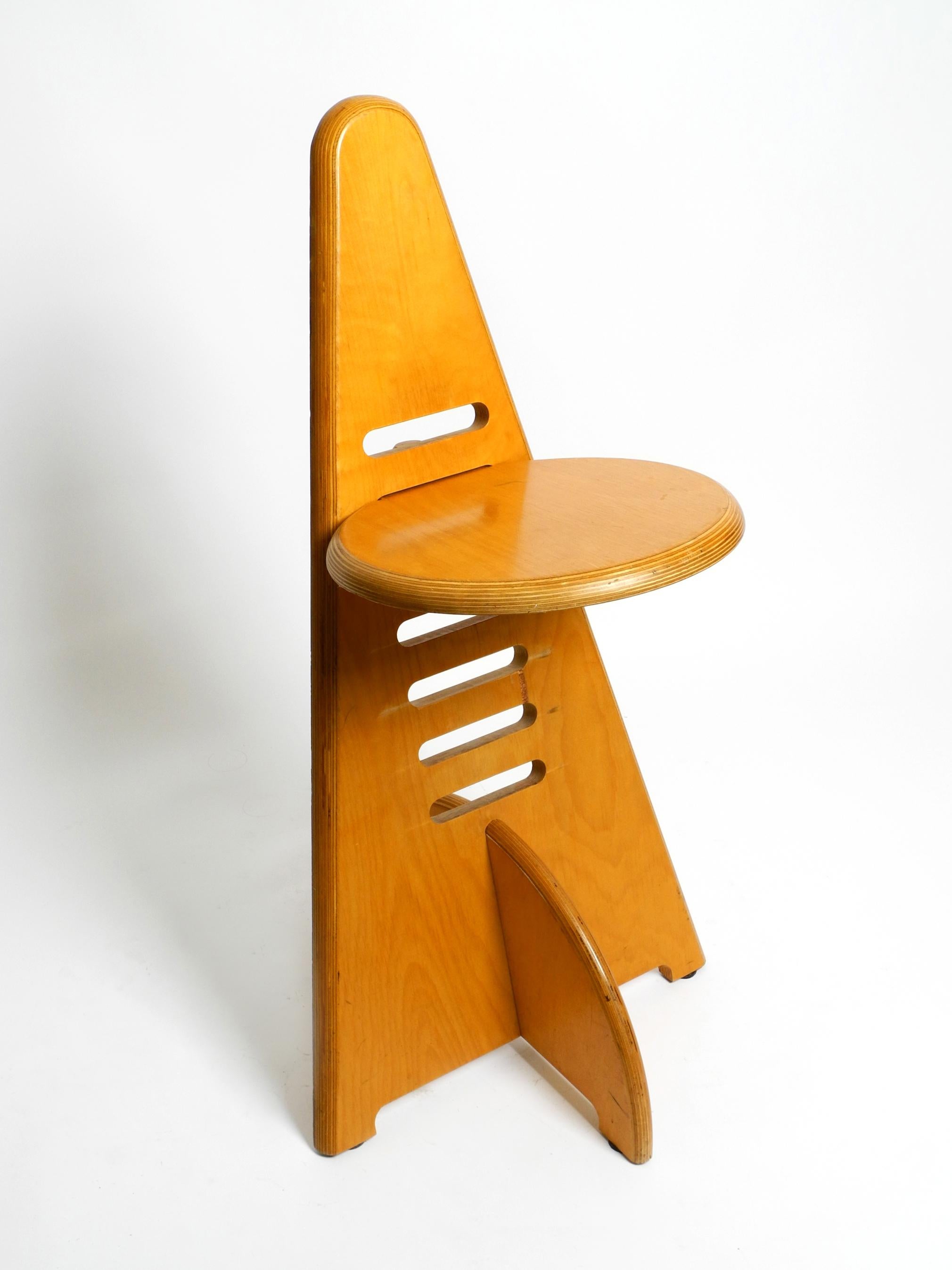 Beautiful 1970s Lundi Sit chair. Design by Gijs Boelaars. Manufactured by Lundia. Made in Netherlands.
Height-adjustable design classic made of birch multiplex.
Triangular shape with a round seat.
Can be used as a chair, bar stool, children's