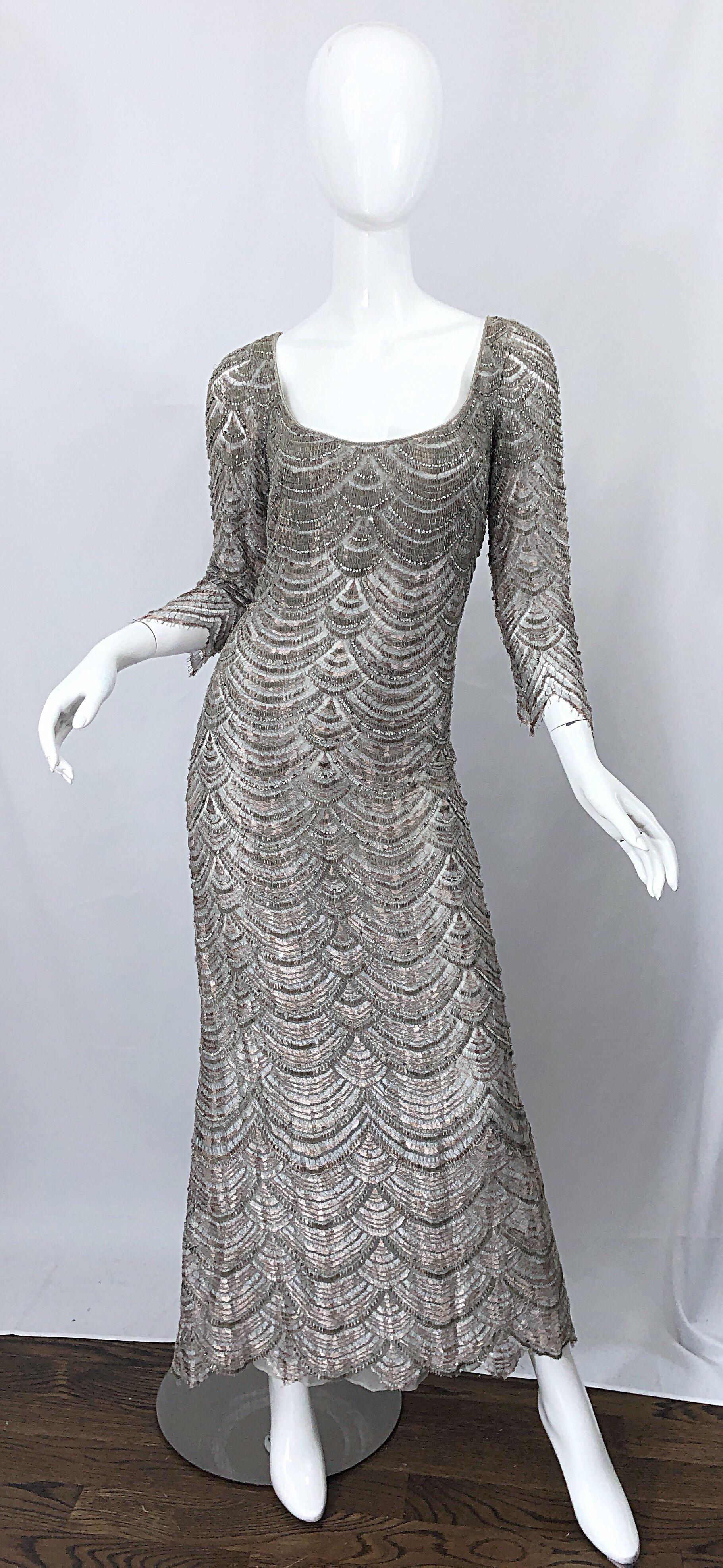 Beautiful vintage 1990s BADGLEY MISCHKA size 12 gray fully beaded + rhinestone deco style evening gown! Features elegant 3/4 sleeves with a fitted bodice and forgiving skirt. Hand crochet embroidery detail thorughout with thousands of 
hand-sewn