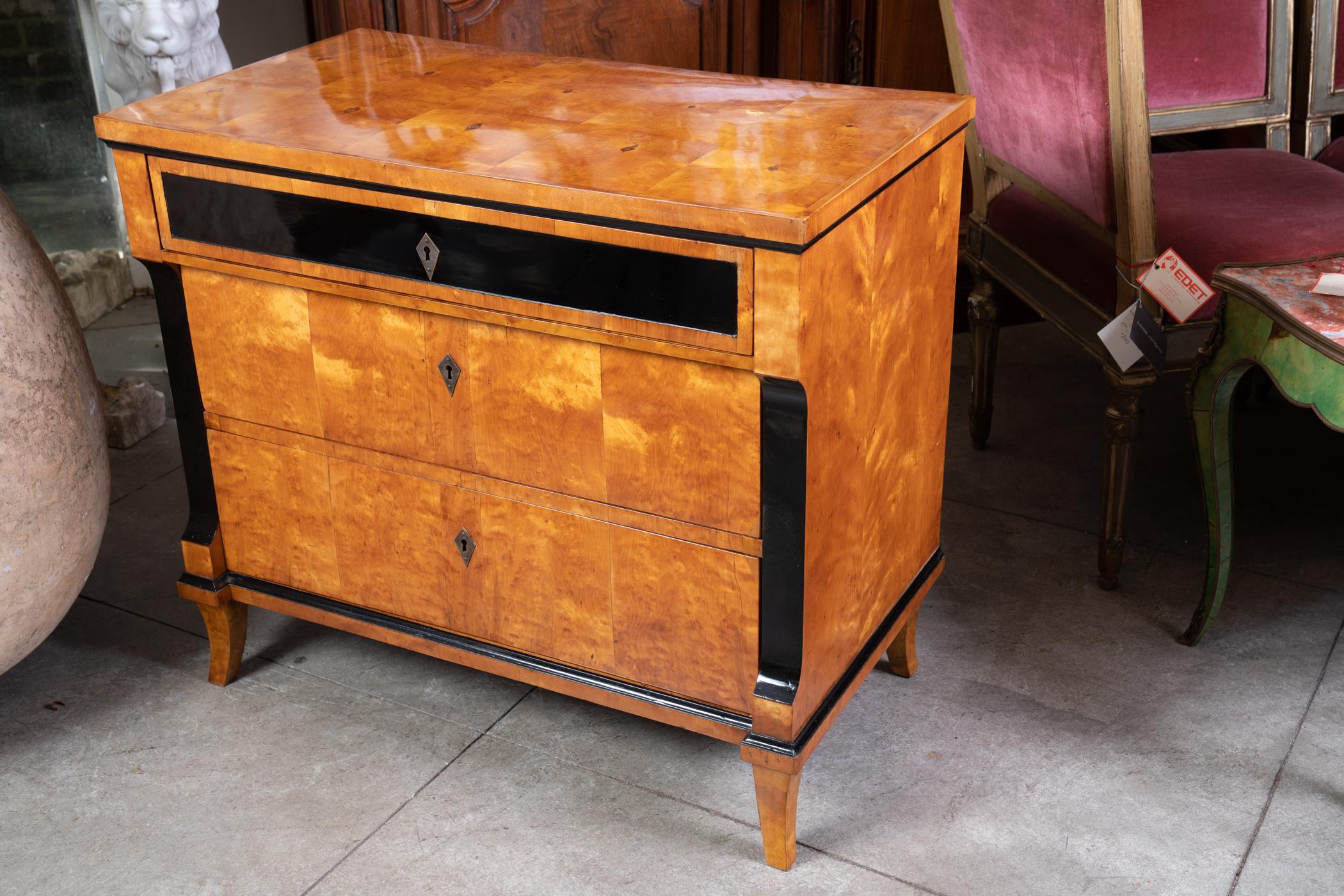 Always chic 19th century Biedermeier maple and ebony commode.