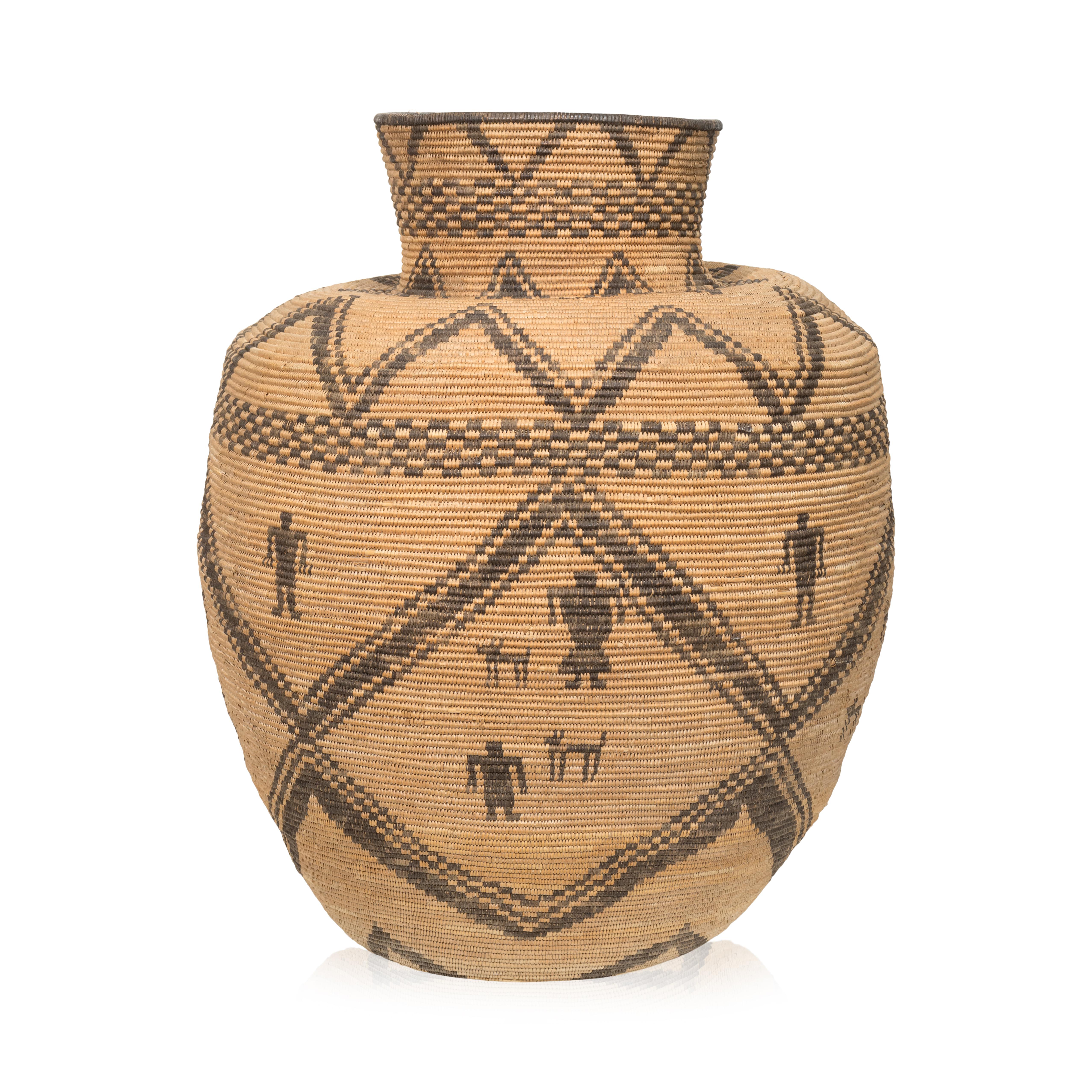 Apache figural basketry olla designed 14 male and female figures and 8 dogs. After an olla was filled to the brim with wild grass seeds such as chia or amaranth, or domestic plant products like corn or beans, a basketry lid or cover was put on top