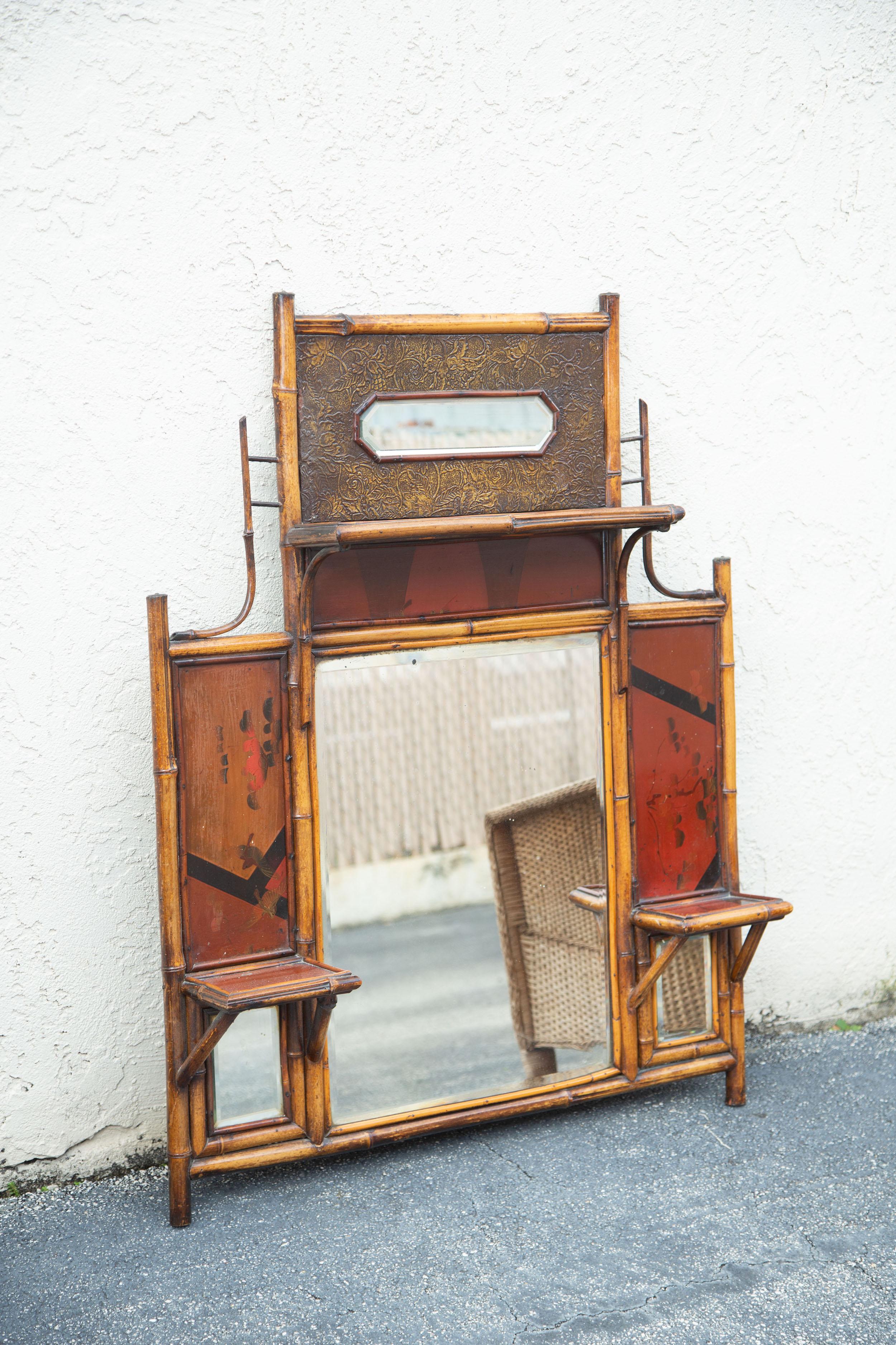 Beautiful 19th century English bamboo wall mirror with Japanning and cable in the back.