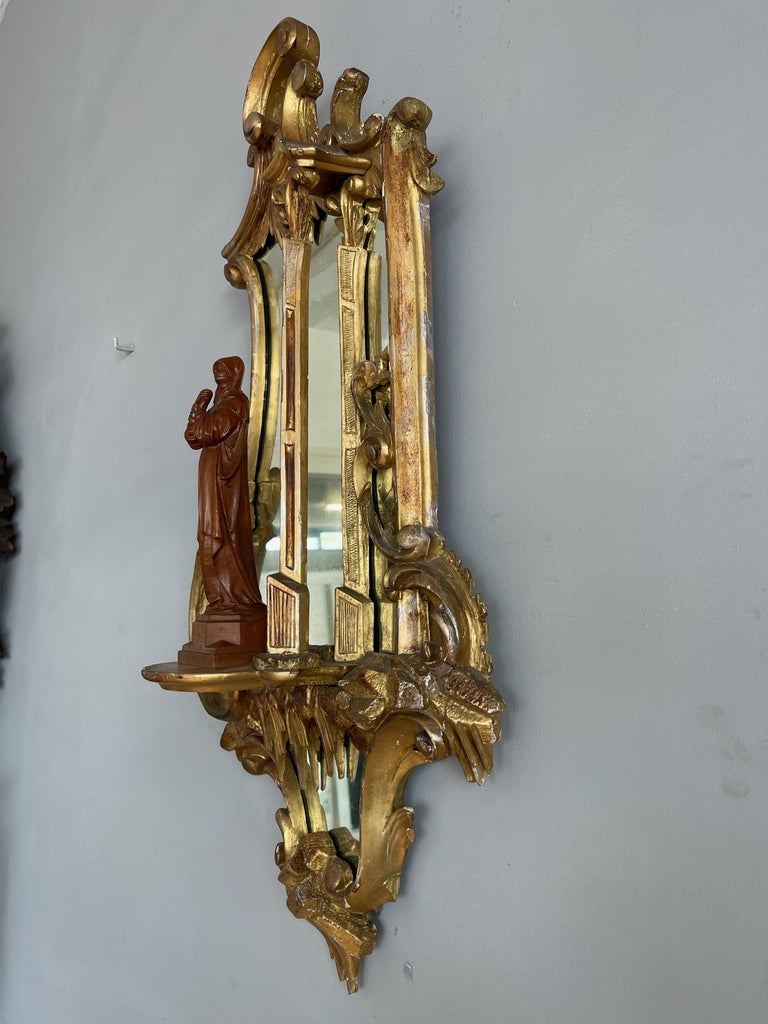 Louis Quinze style wall mirror with beautiful, hand carved details.

If this beautifully handcrafted mirror is the right style to fit your interior and the size is correct for your needs then you could not wish for a better condition one. The