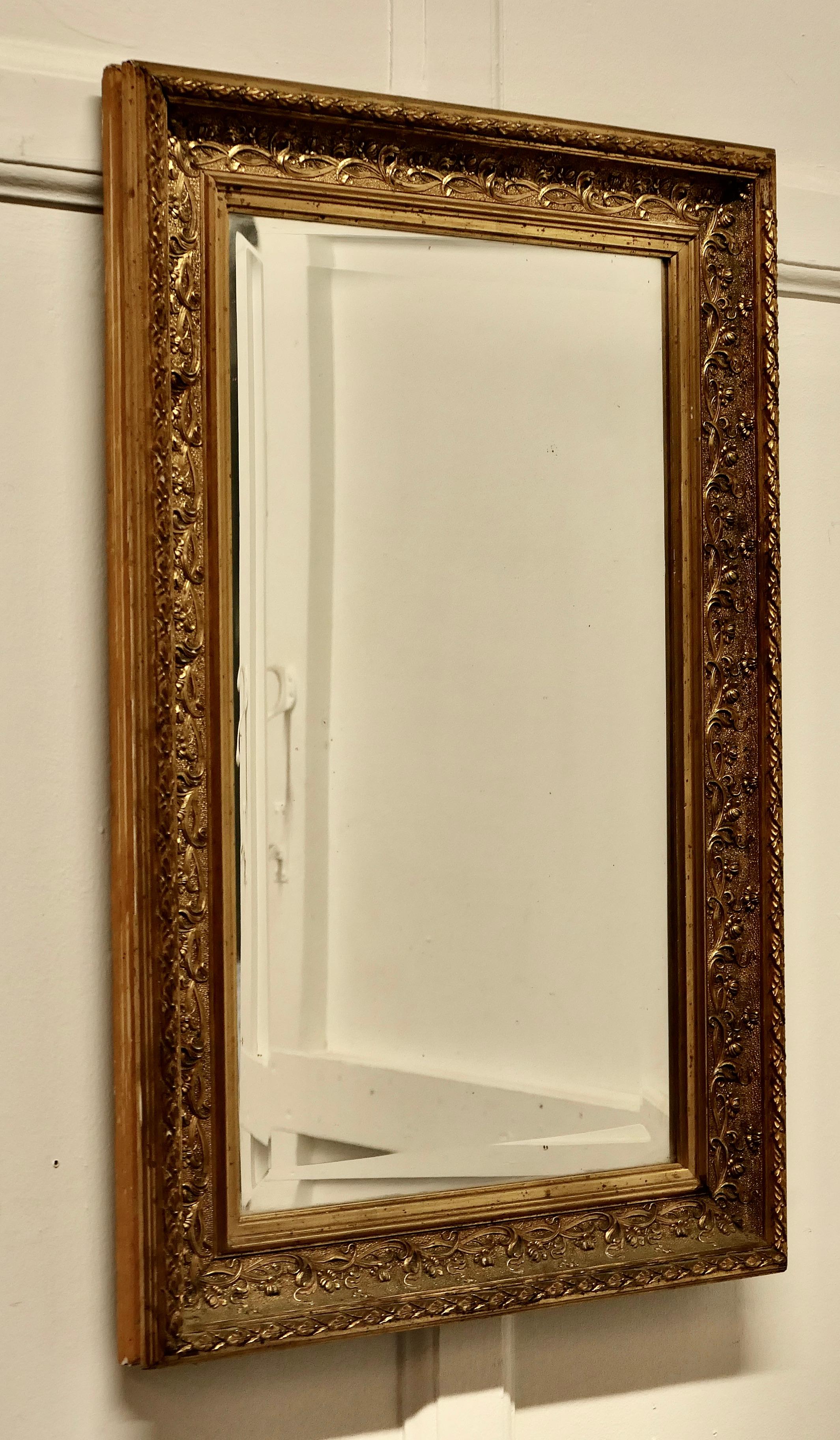 Beautiful 19th century gilt wall mirror

This is a lovely old mirror it is set in a Decorative Gilt 3” wide Frame, 
The looking Glass is original and bevelled and in good condition as is the frame
The overall size is 28” high, 19” wide an it is