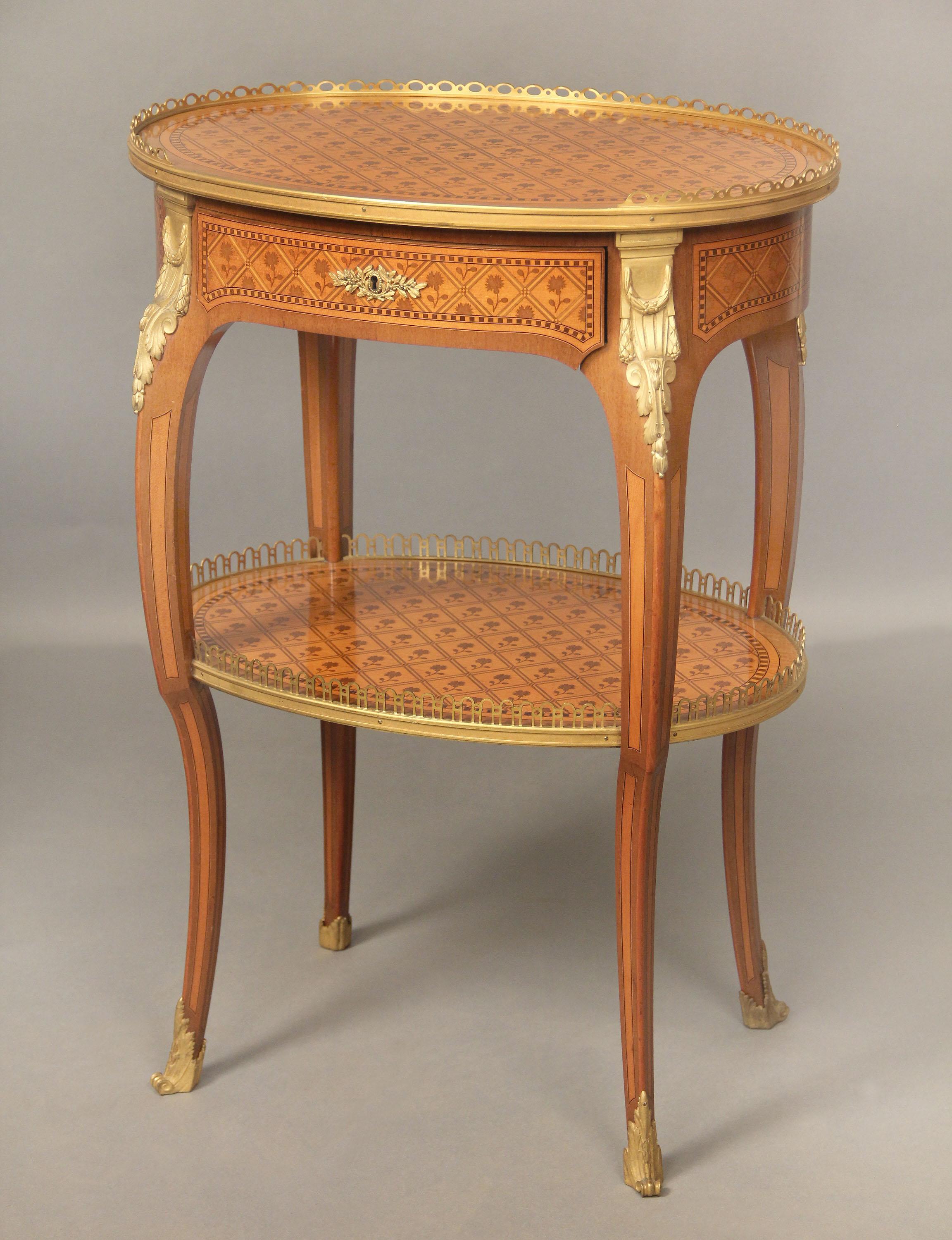 A Beautiful Late 19th Century Louis XV Style Gilt Bronze Mounted Marquetry Lamp Table


The two tier table with a pierced gallery inlaid floral marquetry top above a single drawer.

Details:
Height – 29 inches / 74cm
Width – 20.5 inches / 52cm
Depth
