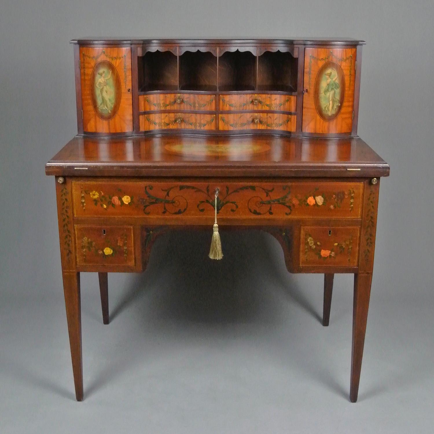 A very fine quality writing desk of Sheraton design in mahogany and satinwood with well shaped upper case and drawers and a fold out writing surface with original red velvet surface set within a beautiful kingwood and satinwood border.

The desk