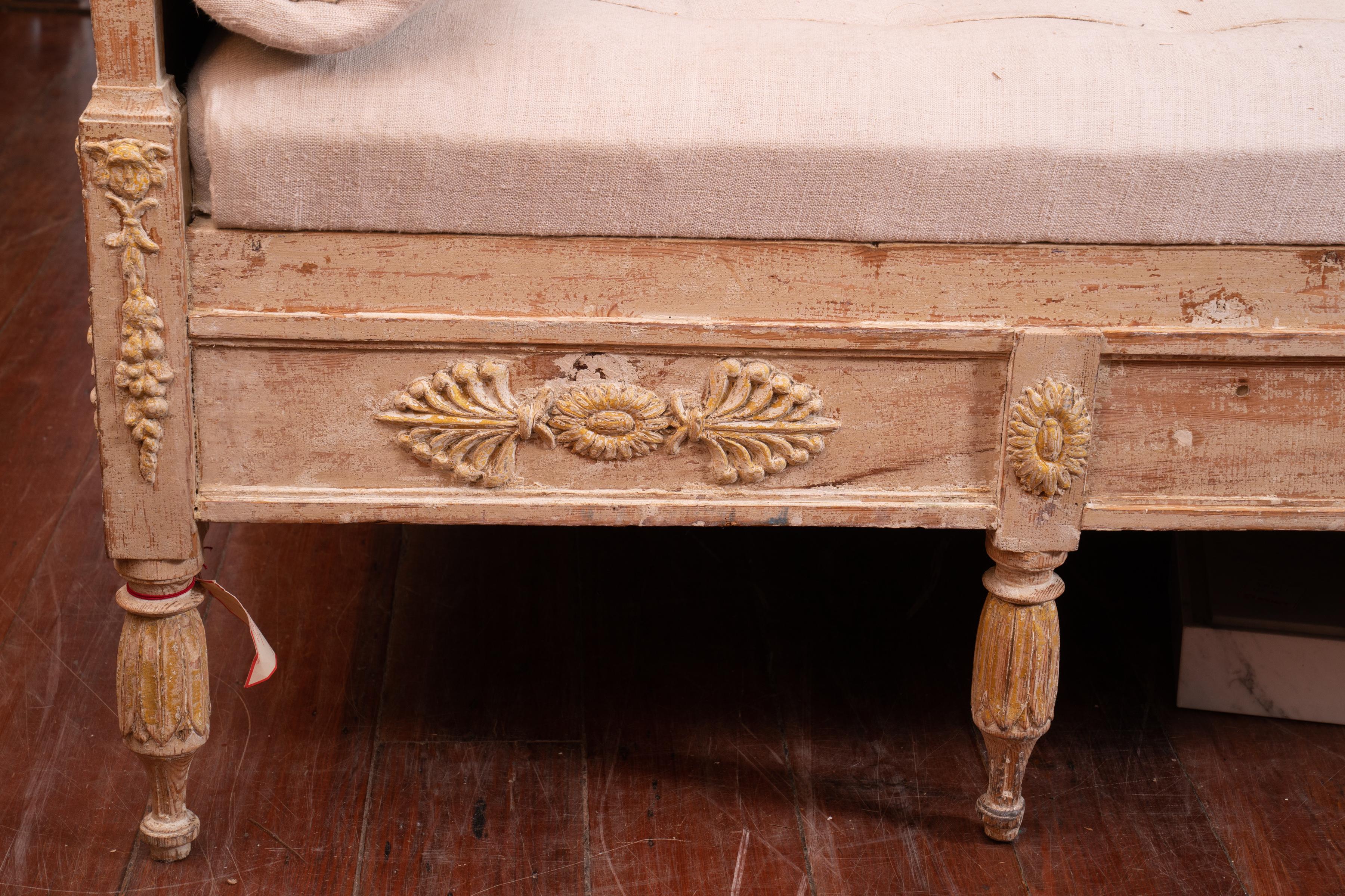Wonderfully carved Gustavian sofa with original painted surface.