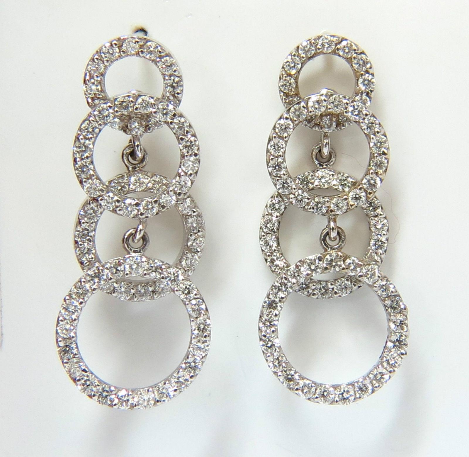 Modern Dangle Deco

Diamond dangle earrings

2.00ct. Diamonds 

G-H color, Vs-2 Si-1 clarity.

14kt. white gold

7.1 grams.

Measures:

30mm long &

12.40mm wide at lower circle

8.12mm at upper circle

$5200 appraisal will accompany