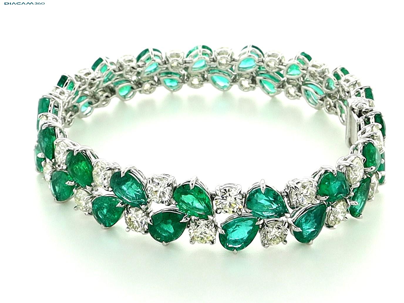 Sophia D platinum bracelet with 35 round diamonds that totals 12.83 carats and 34 pear cut emeralds that totals 22.26 carats.

The length is 18 cm and is about 1 cm wide. 

Sophia D by Joseph Dardashti LTD has been known worldwide for 35 years and