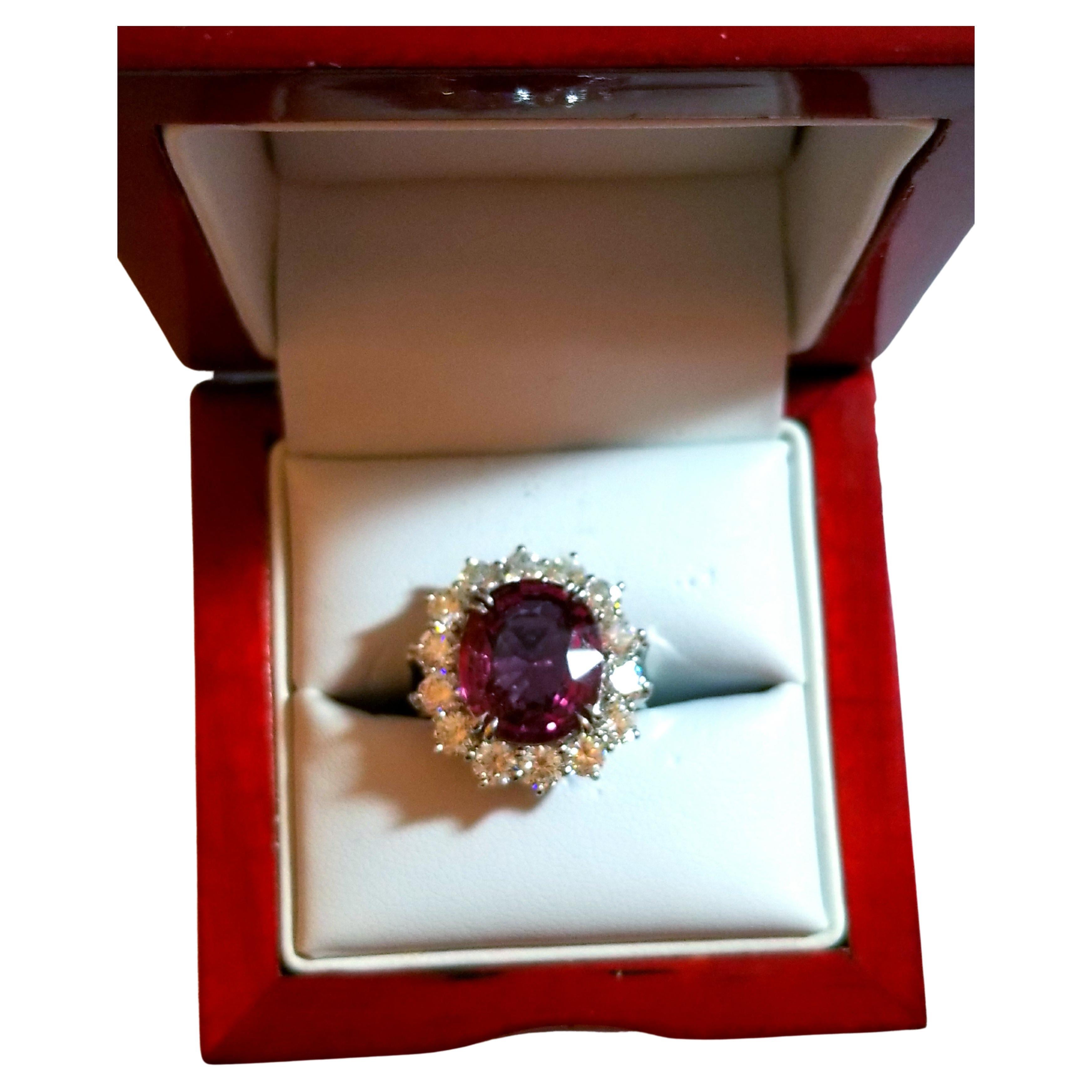 This stunning ring from LaFrancee is a true beauty, featuring a 6.77 CT natural hot pink spinel and diamond accents set in platinum. The ring is in brand new condition, never worn and comes with an AGL certification. The pink spinel is a gorgeous,