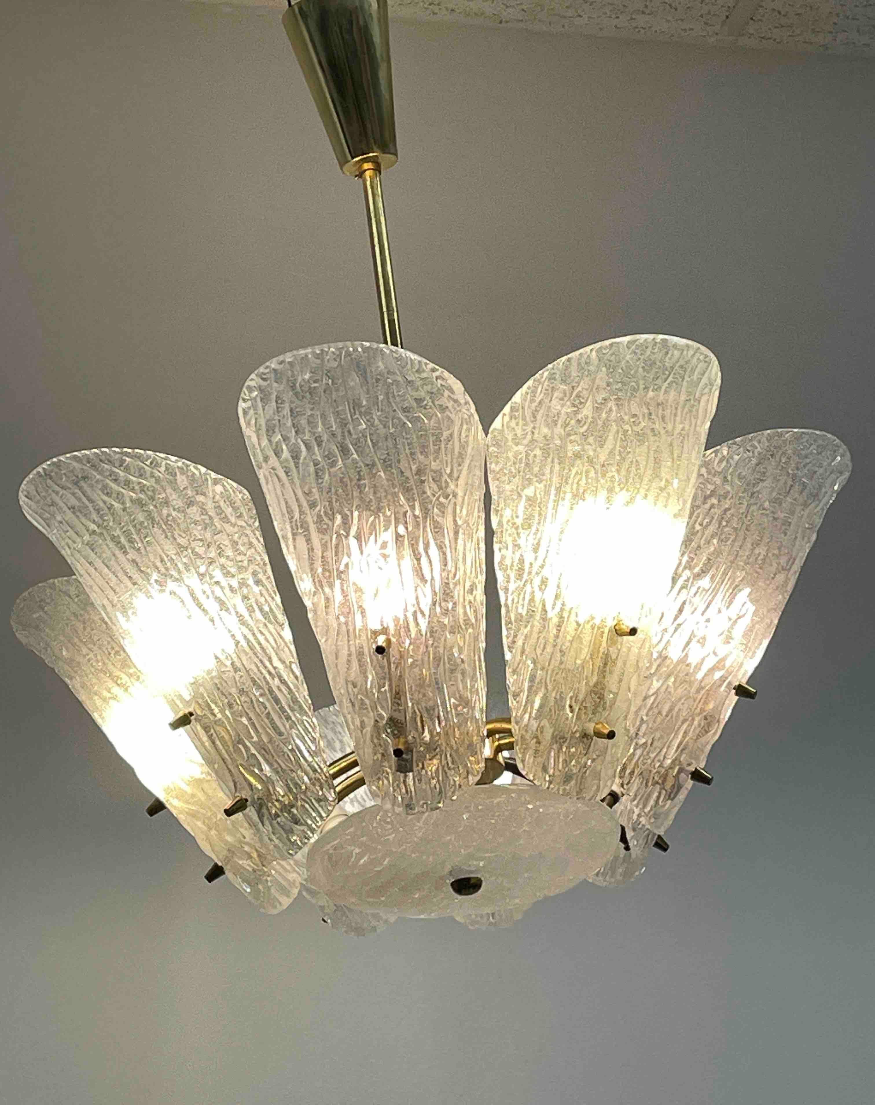 Beautiful and rare chandelier or pendant light by Kalmar Vienna, Austria. An original mid-century vintage piece manufactured in the 1950s. It is made of brass and heavy glass. The fixture requires eight European E14 / 110 Volt Candelabra bulbs, each