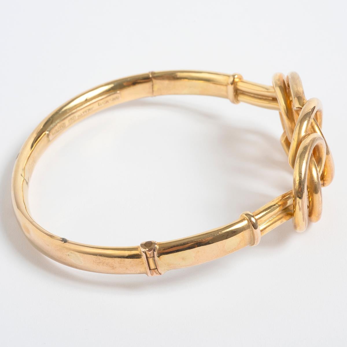 A unique piece within our carefully curated Vintage & Prestige fine jewellery collection, we are delighted to present the following: This beautifully designed torque bangle measures 60mm x 55mm and is set in 9K yellow gold. 