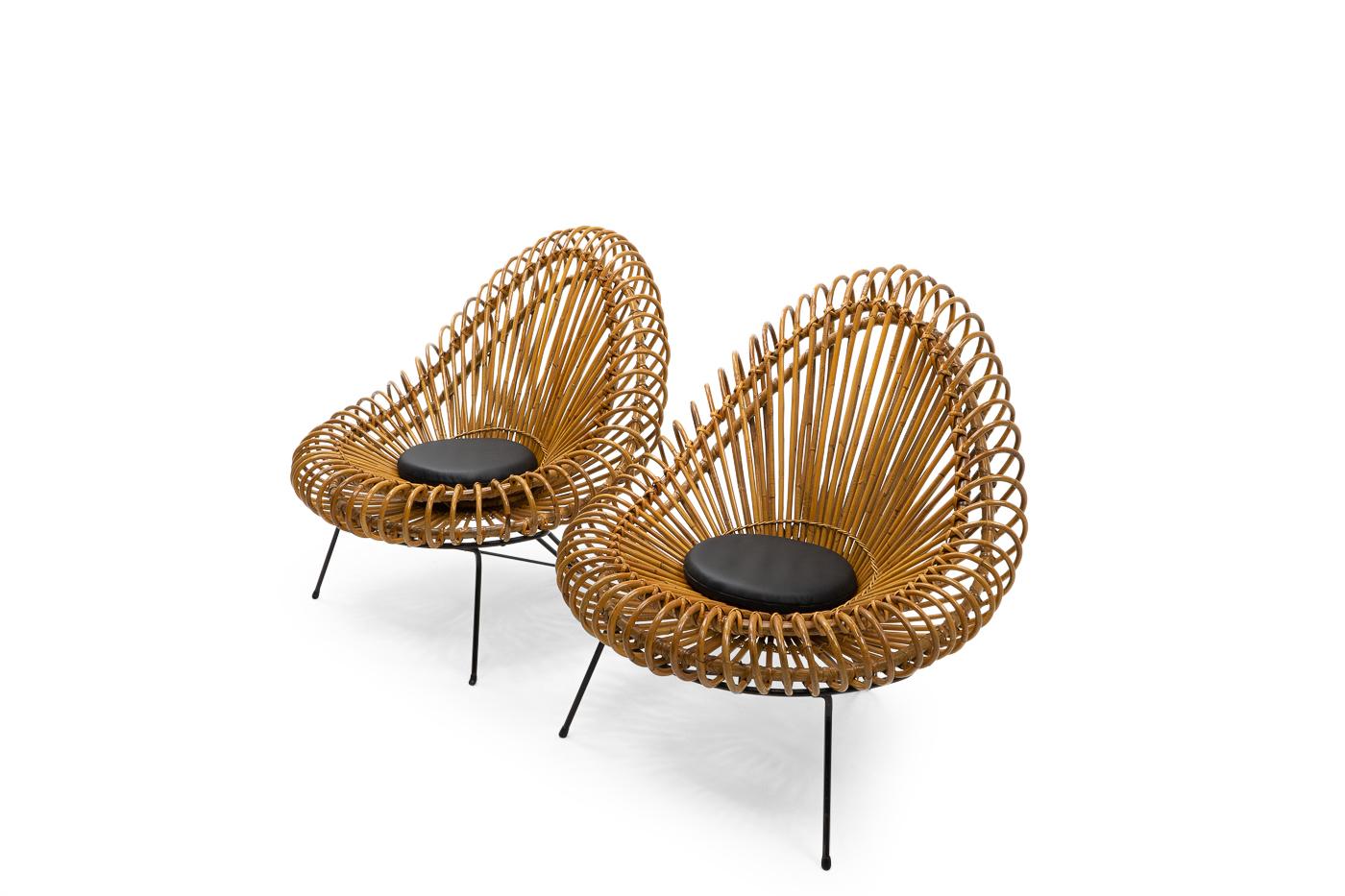A beautiful pair of sculptural rattan lounge chairs attributed to Janine Abraham and Dirk Jan Rol. 

The chairs have a bent rattan structure, supported by an iron frame, and are typical of the style of the aforementioned design couple. 

Both