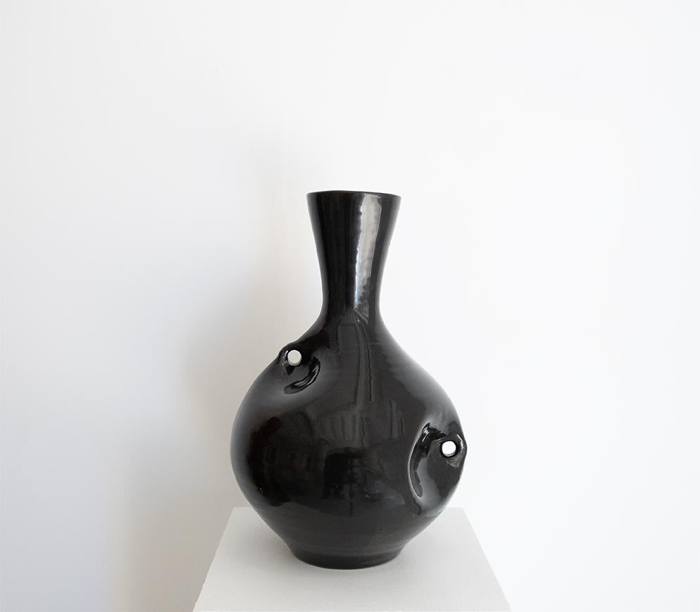 ACCOLAY (manufacture) (1945-1989)

Very decorativ free form black pearly enamelled vase.
France, circa 1960.
Signed.



