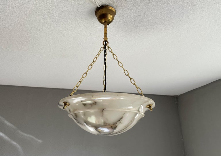 Museum quality and condition, antique white alabaster light fixture with perfect spread of black veins.

With early 20th century light fixtures being one of our specialities, we love finding timeless light fixtures that we know will look great in