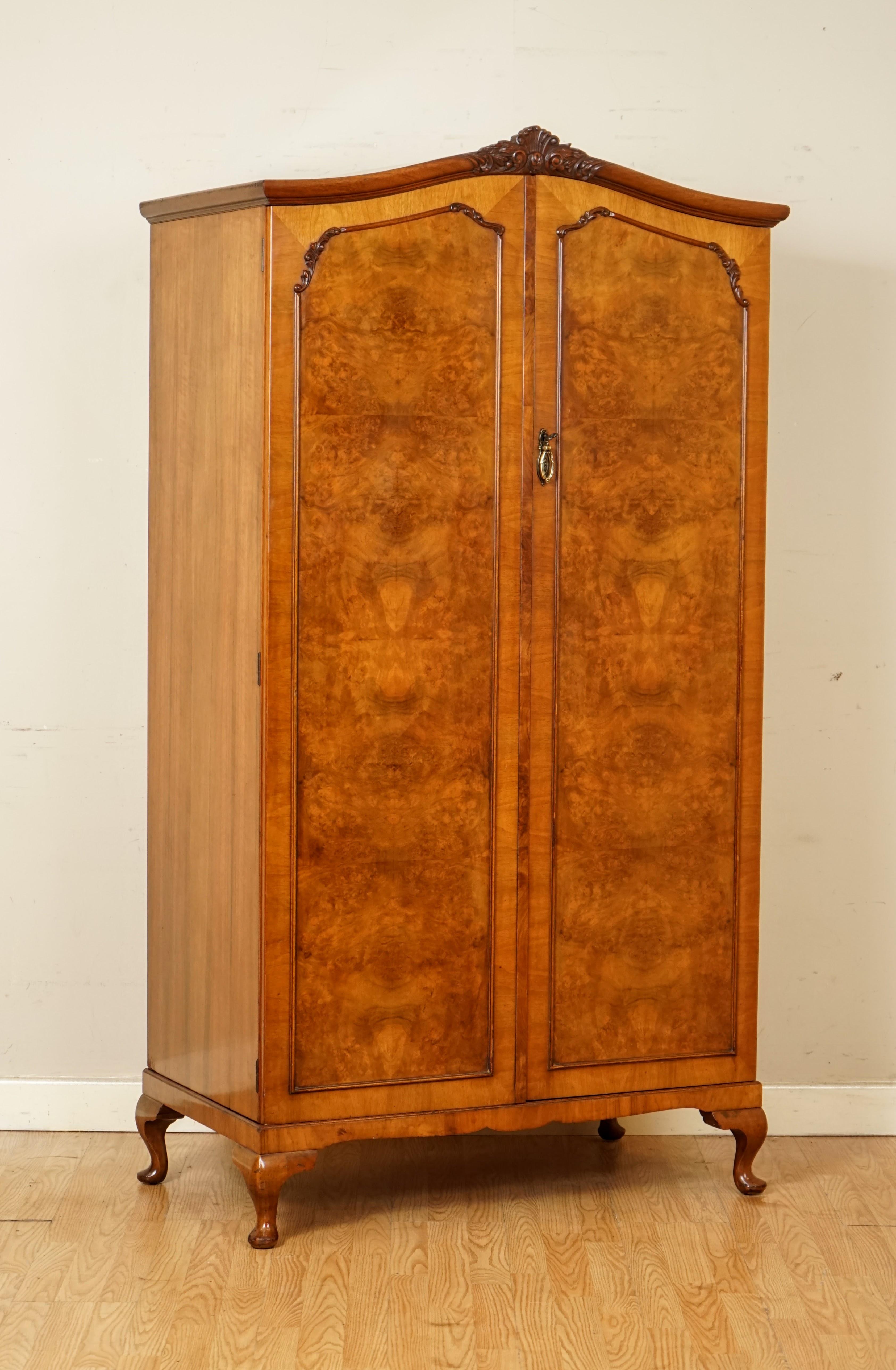 We are so excited to present to you this beautiful Alfred Cox London burr walnut double wardrobe.

Here we have a good quality antique English carved burr walnut wardrobe. Circa 1930's made by the British iconic designer and cabinetmaker, Alfred
